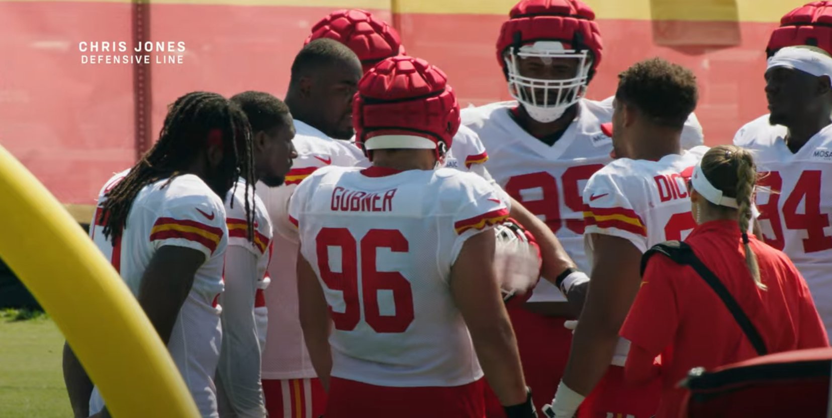 Chris Jones speaks to the D-Line group after practice at training camp.