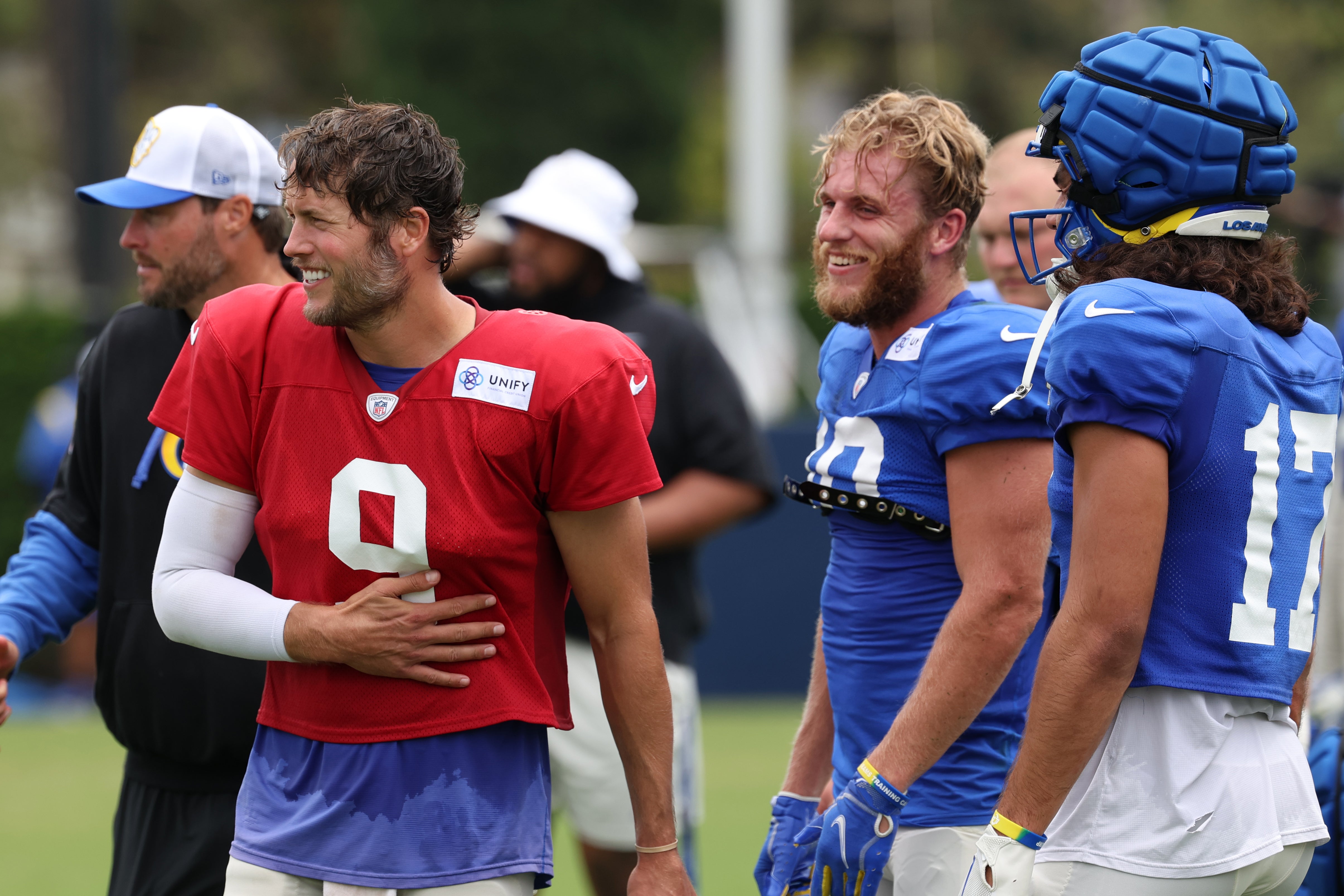 Aug 1, 2024; Los Angeles, CA, USA; Los Angeles Rams quarterback Matthew Stafford (9) talks with wide receiver Cooper Kupp (10) and wide receiver Puka Nacua (17) during training camp at Loyola Marymount University. Mandatory Credit: Kiyoshi Mio-USA TODAY Sports