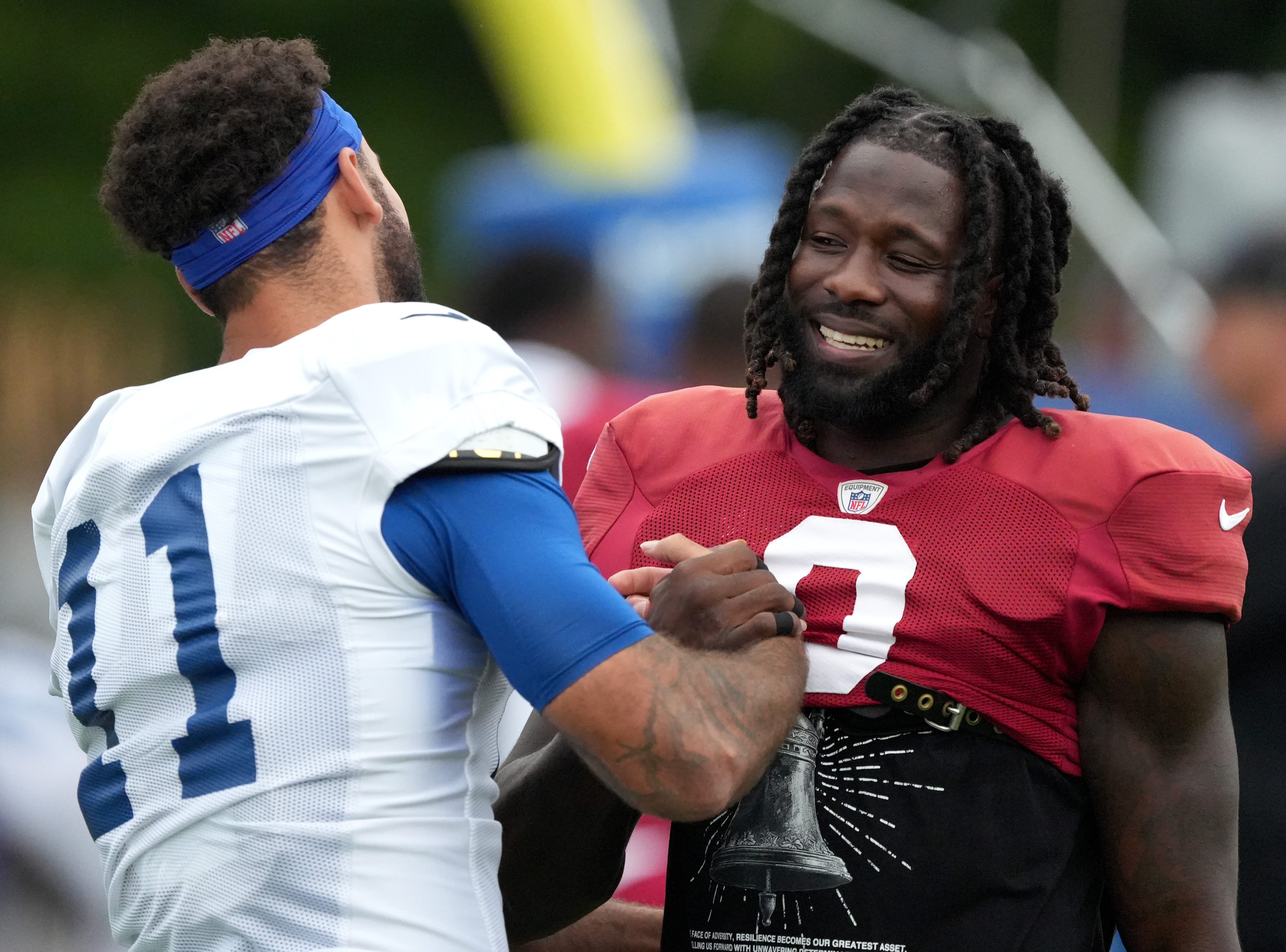 Indianapolis Colts wide receiver Michael Pittman Jr. (11) greets Arizona Cardinals wide receiver Zach Pascal (0) during a joint practice Thursday, Aug. 15, 2024, at Grand Park Sports Complex in Westfield.