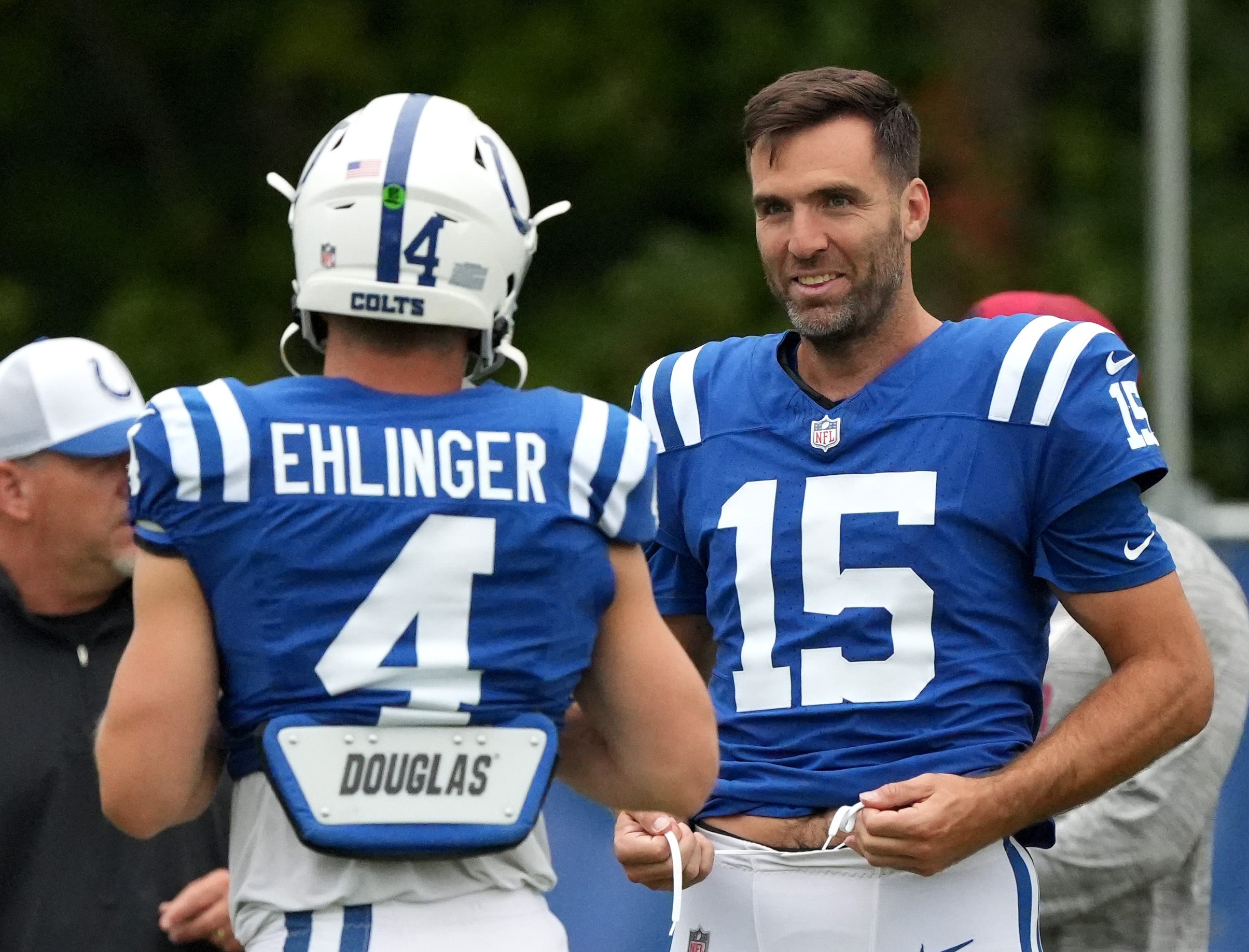 Indianapolis Colts quarterback Sam Ehlinger (4) chats with quarterback Joe Flacco (15) during a joint practice with the Arizona Cardinals Thursday, Aug. 15, 2024, at Grand Park Sports Complex in Westfield.