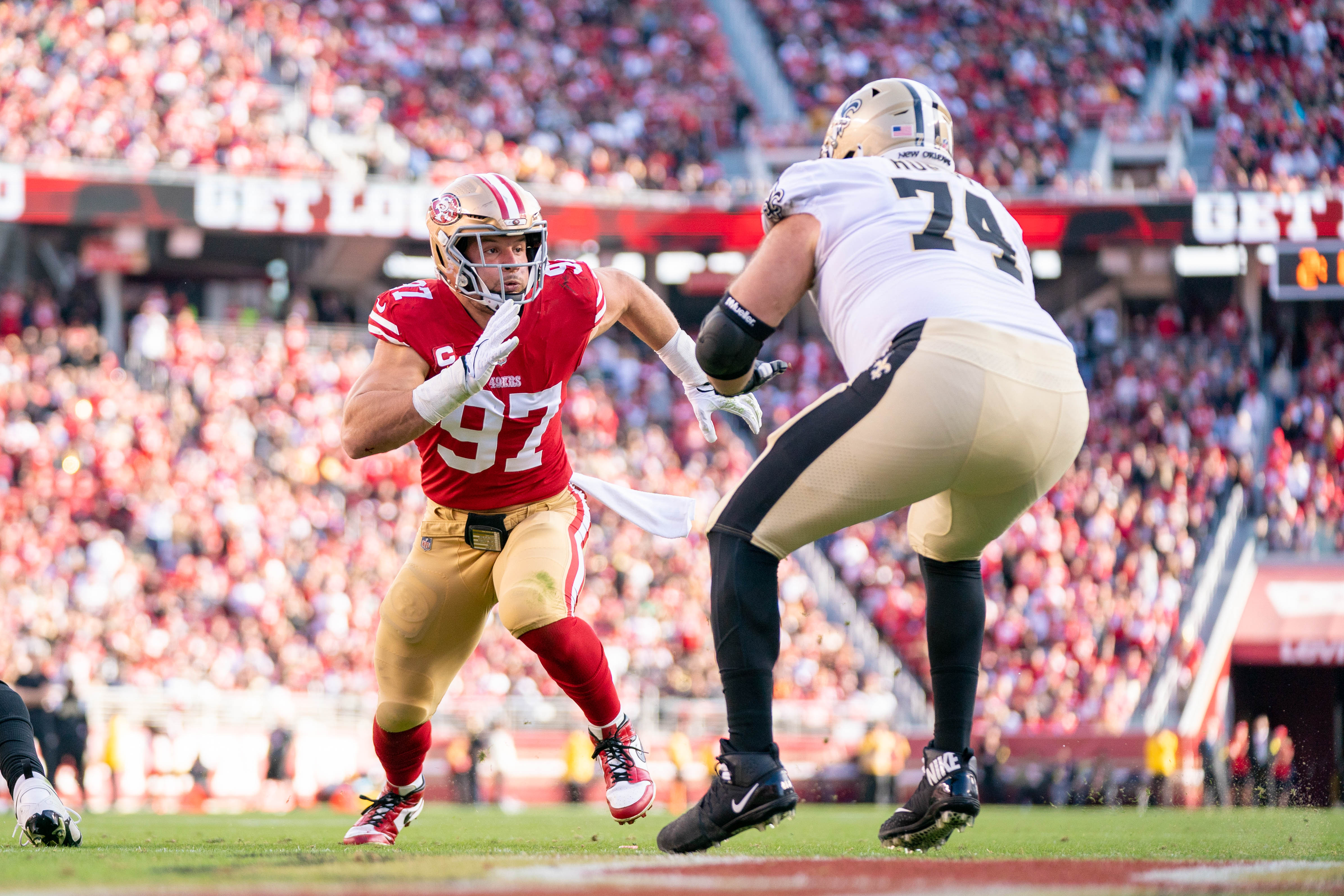 November 27, 2022; Santa Clara, California, USA; San Francisco 49ers defensive end Nick Bosa (97) rushes against New Orleans Saints offensive tackle James Hurst (74) during the second quarter at Levi's Stadium.