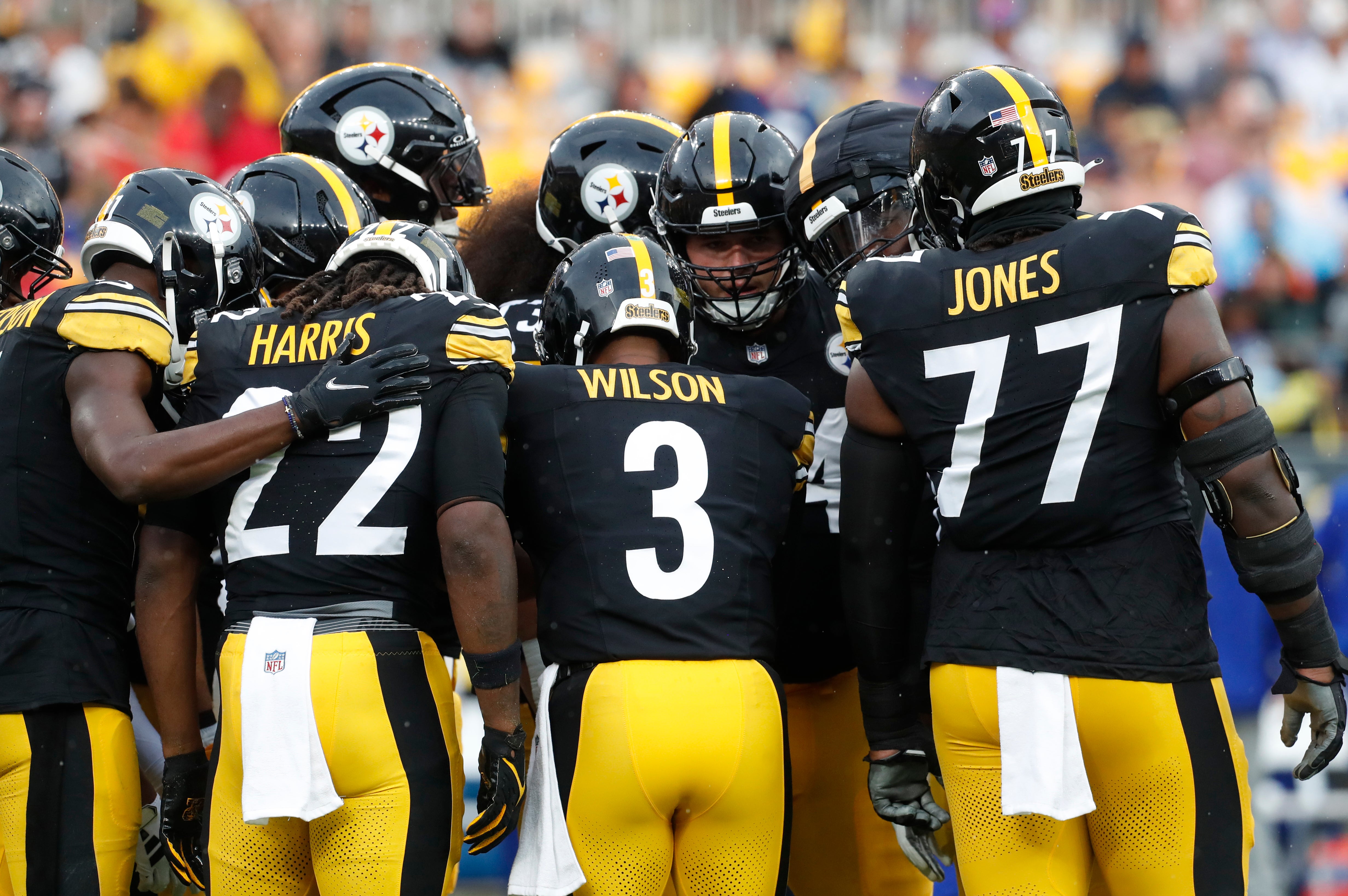 Aug 17, 2024; Pittsburgh, Pennsylvania, USA; Pittsburgh Steelers quarterback Russell Wilson (3) calls a play in the huddle against the Buffalo Bills during the first quarter at Acrisure Stadium. Mandatory Credit: Charles LeClaire-USA TODAY Sports  