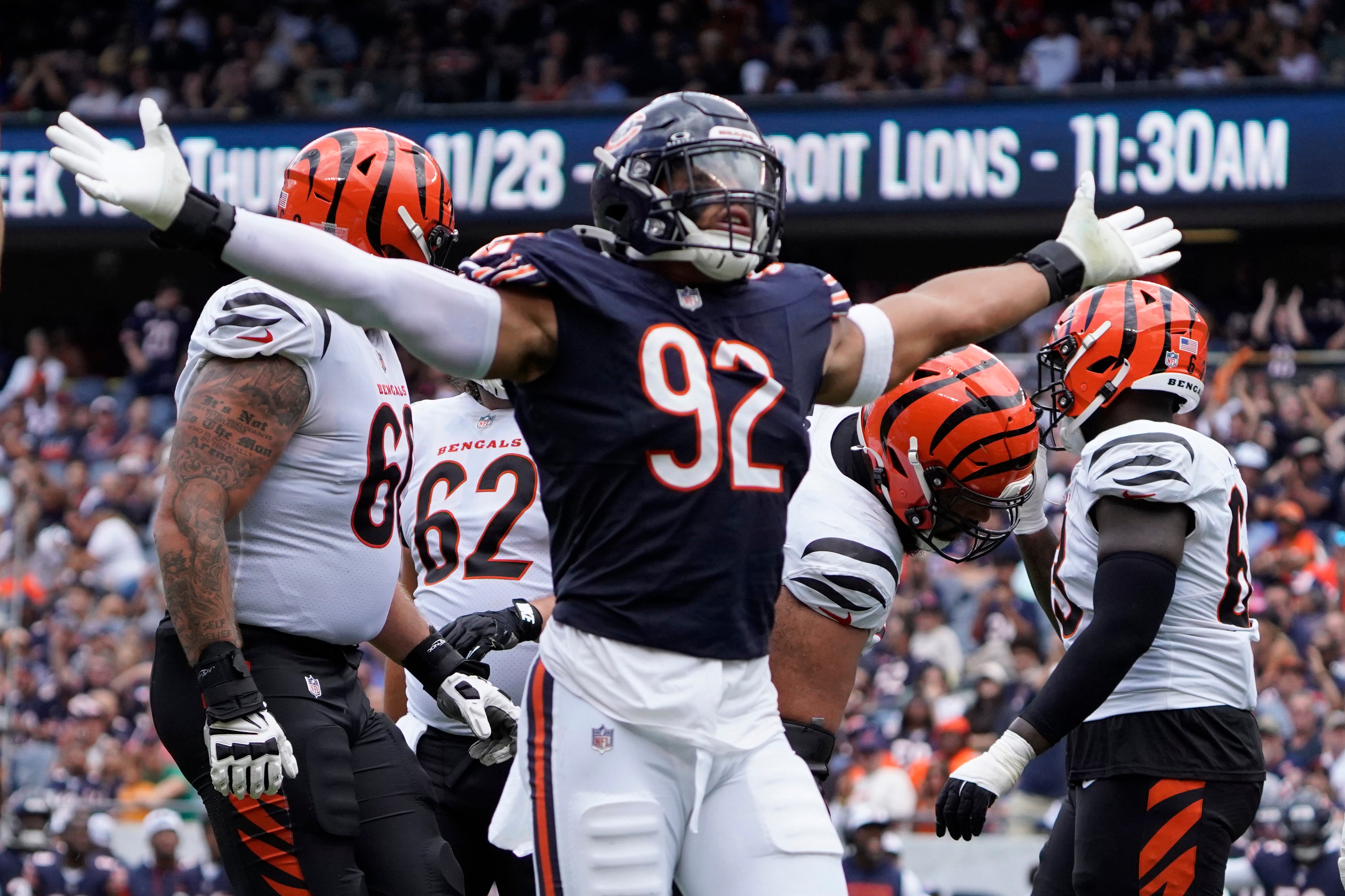 Aug 17, 2024; Chicago, Illinois, USA; Chicago Bears defensive end Daniel Hardy (92) celebrates his sack of Cincinnati Bengals quarterback Logan Woodside (11) during the second half at Soldier Field.