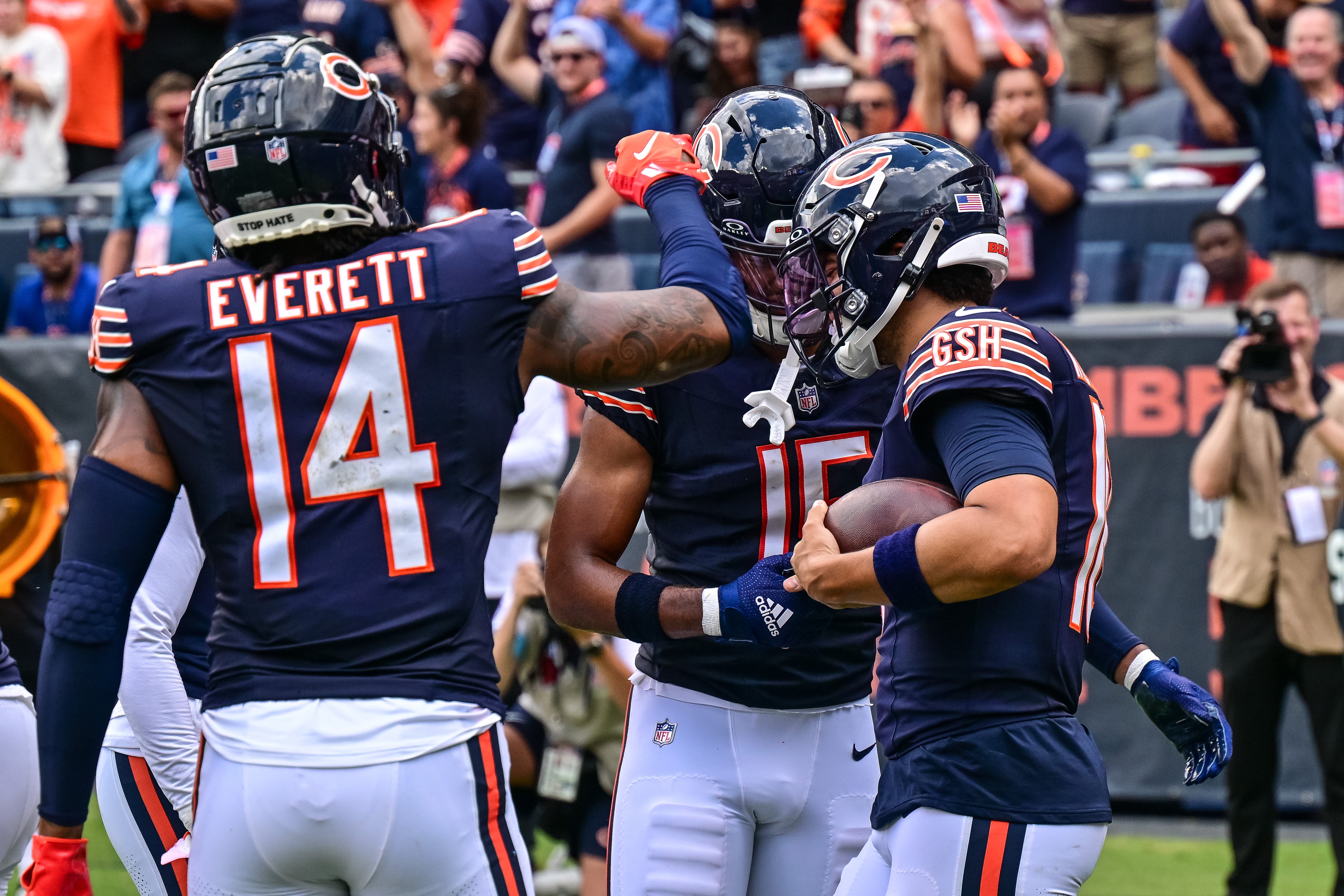 Aug 17, 2024; Chicago, Illinois, USA; Chicago Bears quarterback Caleb Williams (18) celebrates his rushing touchdown against the Cincinnati Bengals during the second quarter at Soldier Field.