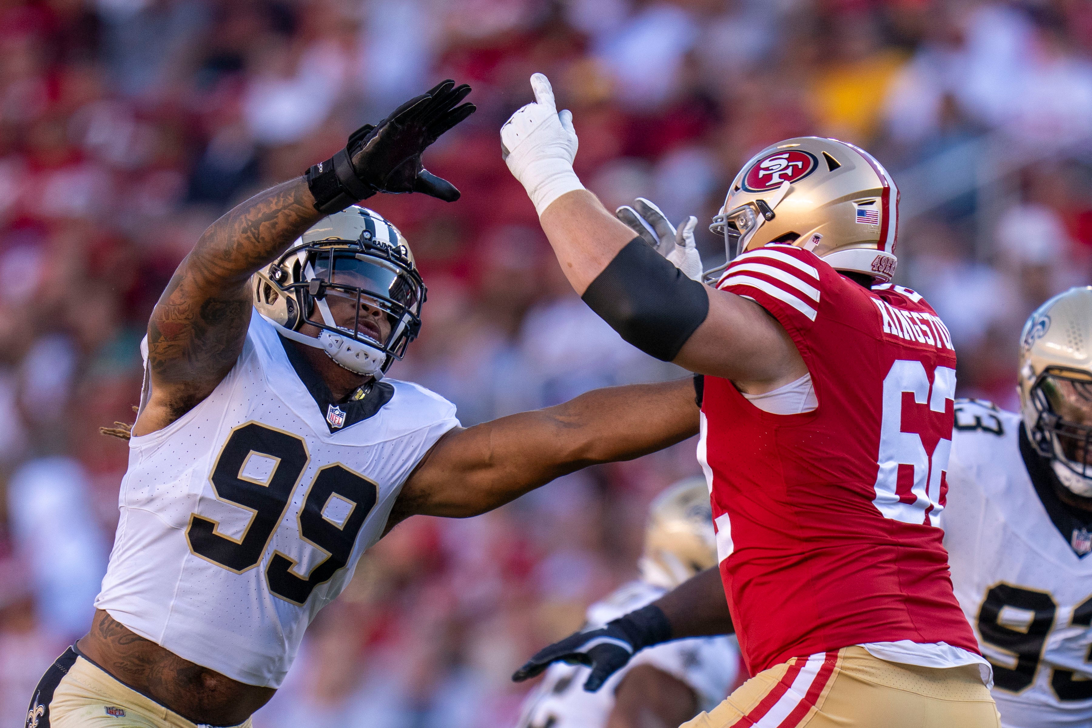 August 18, 2024; Santa Clara, California, USA; New Orleans Saints defensive end Chase Young (99) rushes against San Francisco 49ers guard Jarrett Kingston (62) during the second quarter at Levi's Stadium.