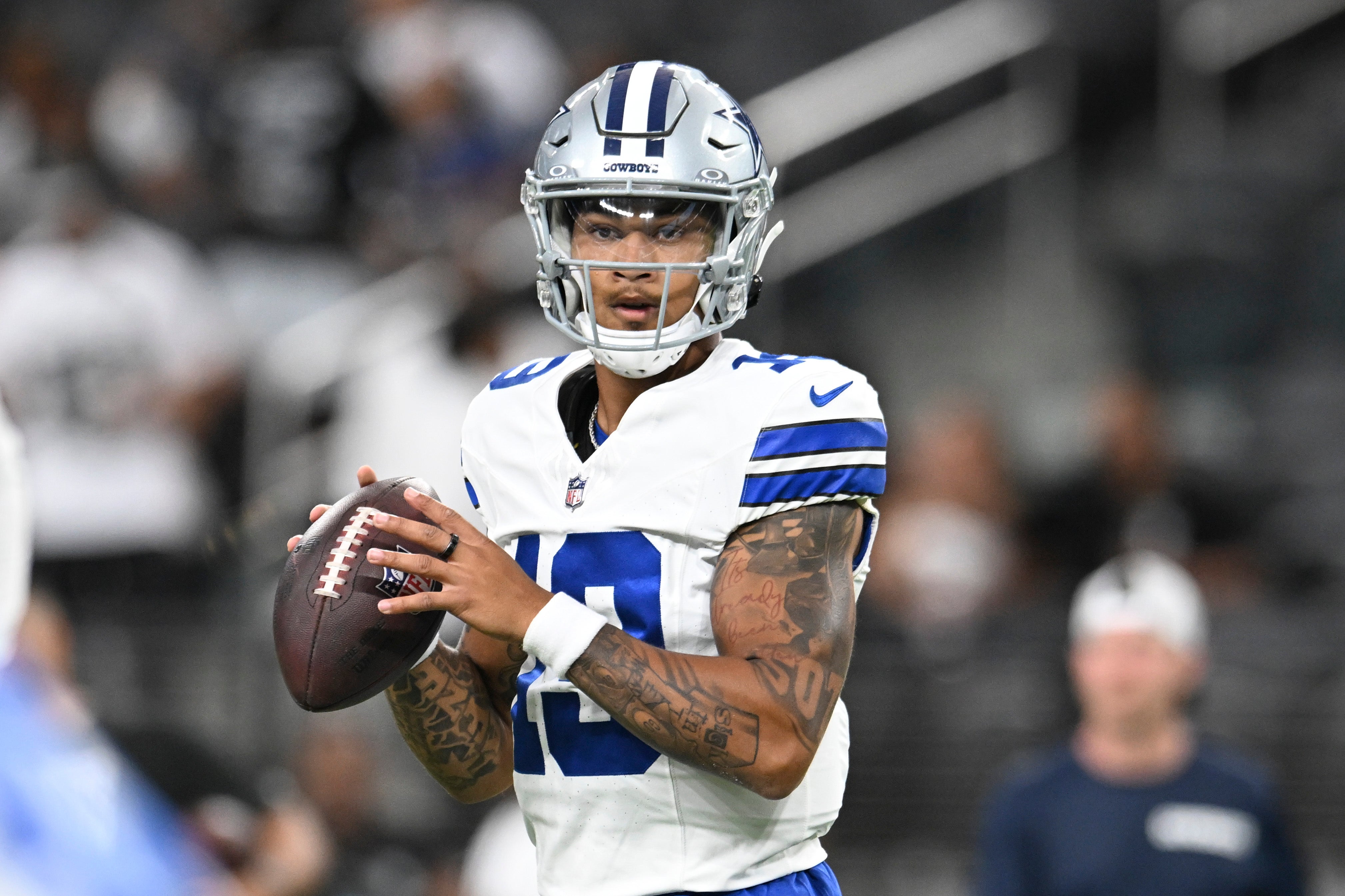 Dallas Cowboys QB Trey Lance warms up against the Las Vegas Raiders.
