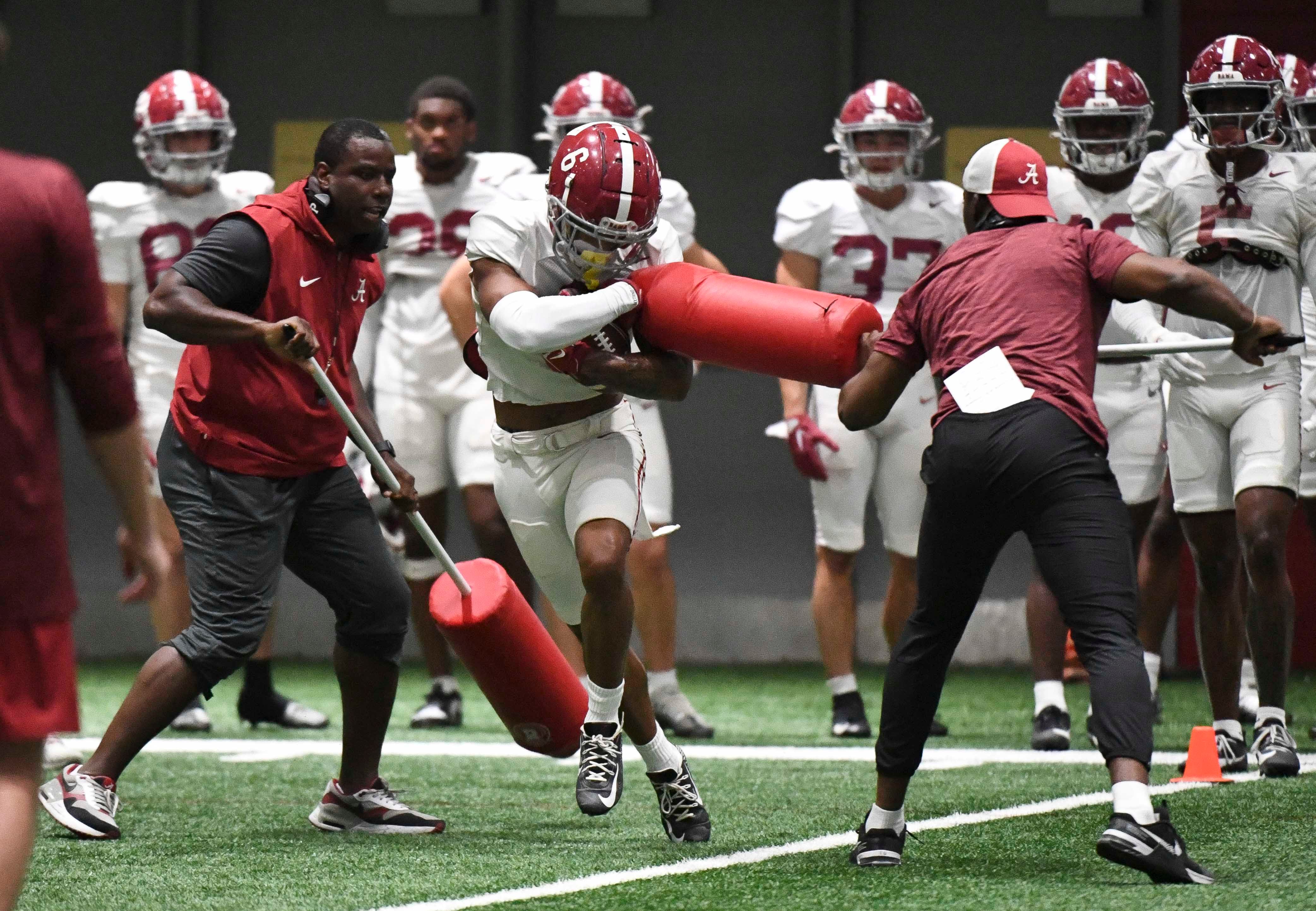 April 9, 2024; Tuscaloosa, Alabama, USA; Alabama wide receiver Kobe Prentice (6) catches a pass and fights through a drill during practice in the Hank Crisp Indoor Practice Facility at the University of Alabama.