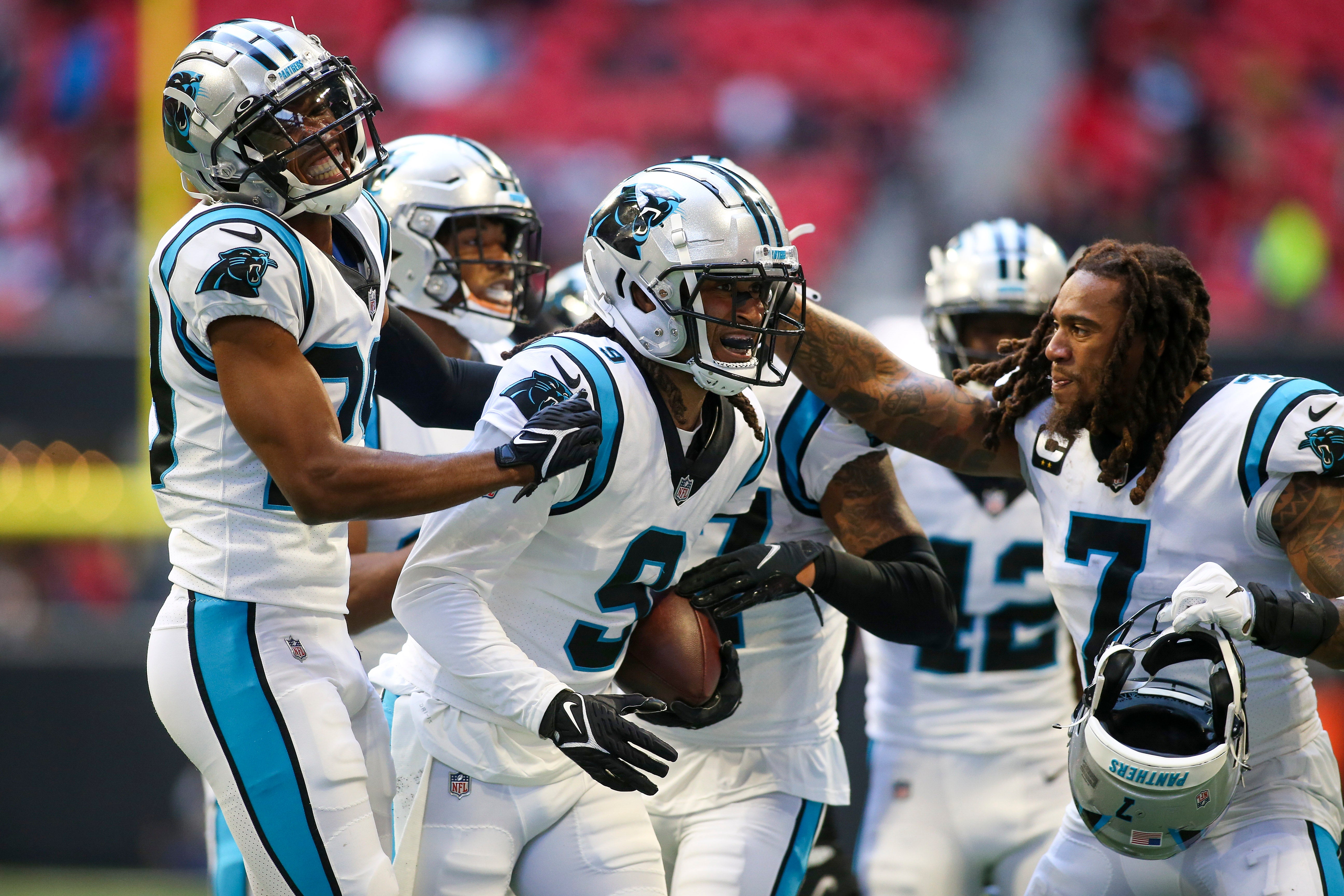 Oct 31, 2021; Atlanta, Georgia, USA; Carolina Panthers cornerback Stephon Gilmore (9) celebrates after an interception with teammates against the Atlanta Falcons in the fourth quarter at Mercedes-Benz Stadium. Mandatory Credit: Brett Davis-USA TODAY Sports