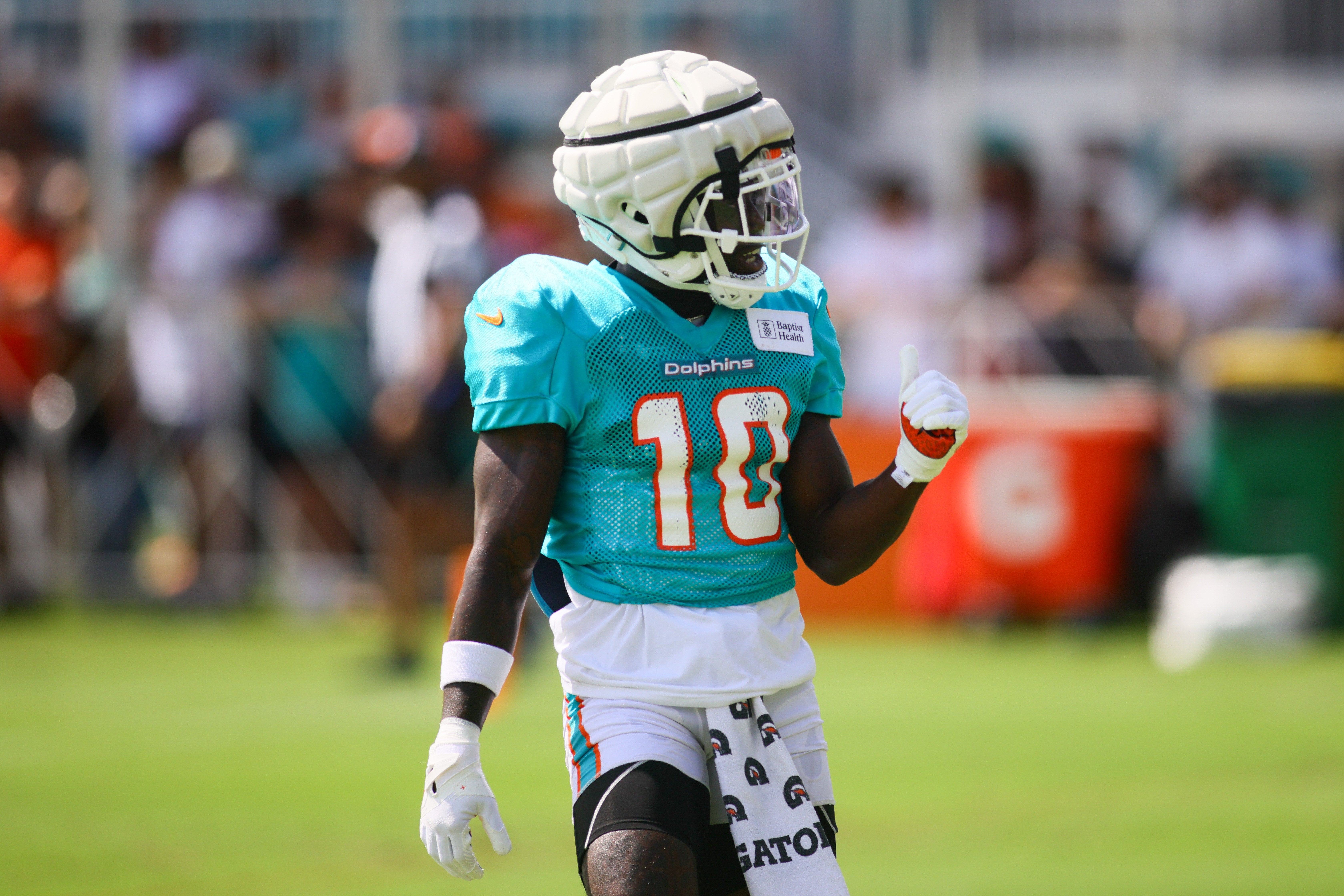 Aug 6, 2024; Miami Gardens, FL, USA; Miami Dolphins wide receiver Tyreek Hill (10) reacts during a joint practice with the Atlanta Falcons at Baptist Health Training Complex.