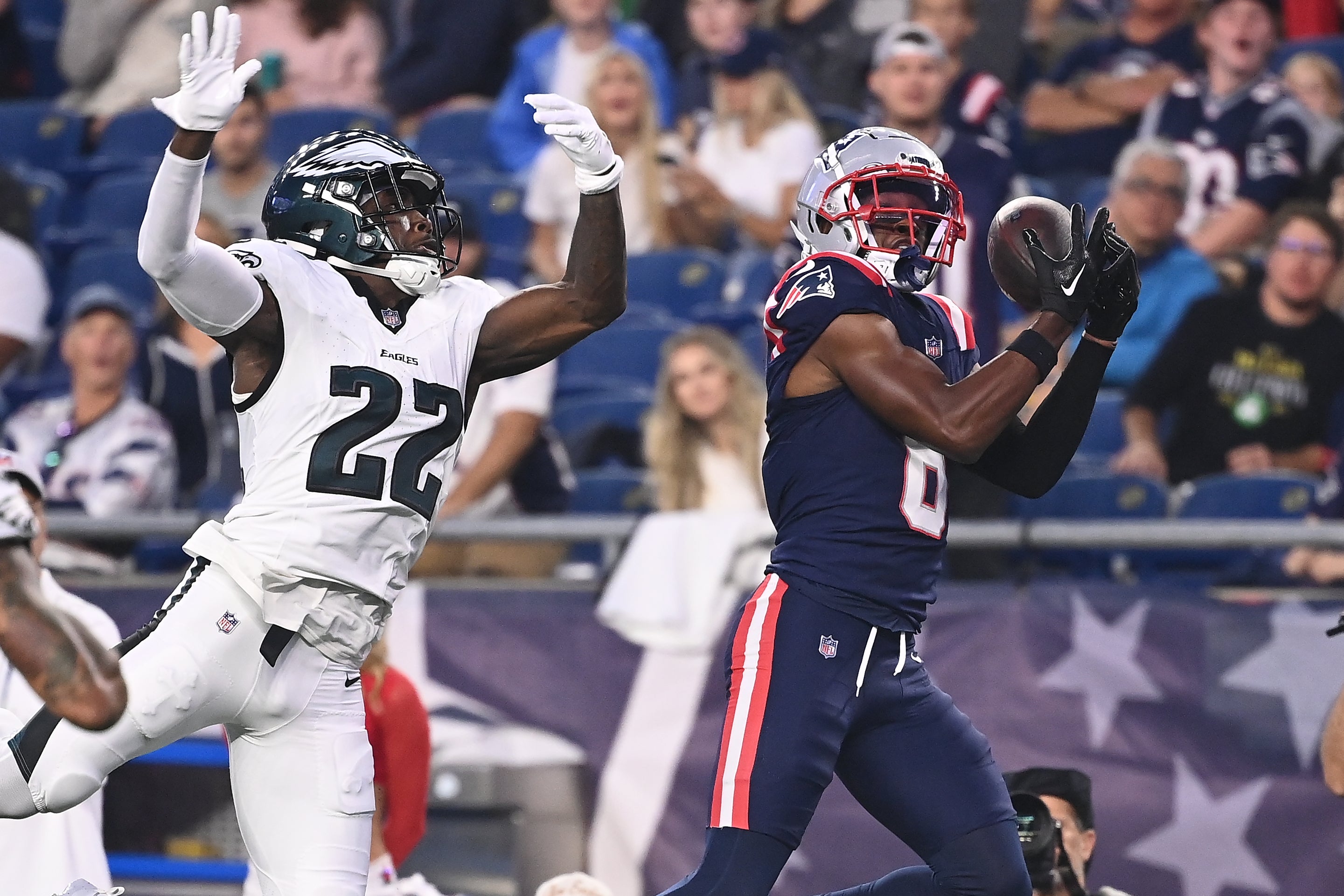 New England Patriots wide receiver Javon Baker (6) tris to make a catch while being covered by Philadelphia Eagles cornerback Kelee Ringo (22) during the first half at Gillette Stadium.