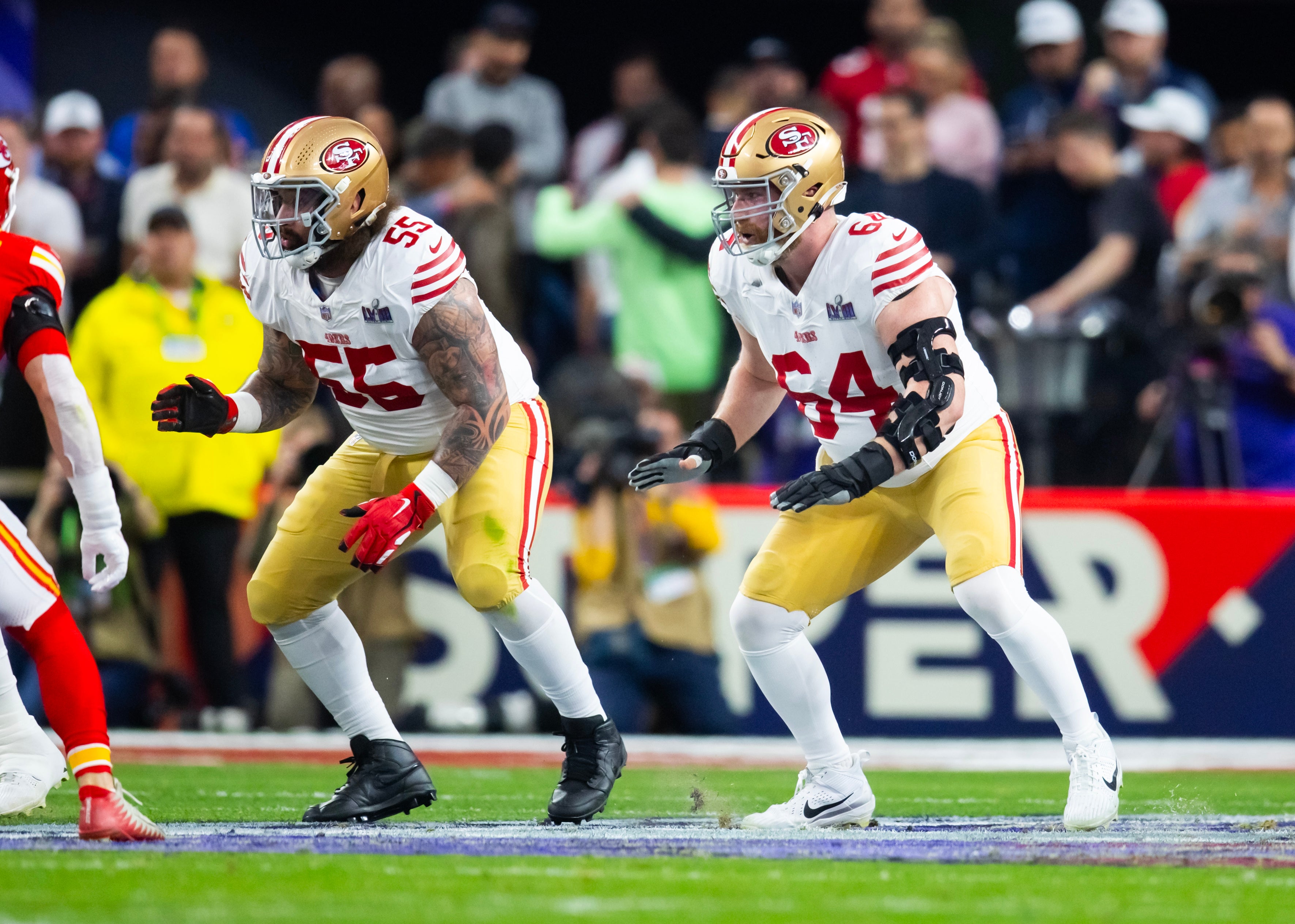 Feb 11, 2024; Paradise, Nevada, USA; San Francisco 49ers guard Jon Feliciano (55) and center Jake Brendel (64) against the Kansas City Chiefs in Super Bowl LVIII at Allegiant Stadium.