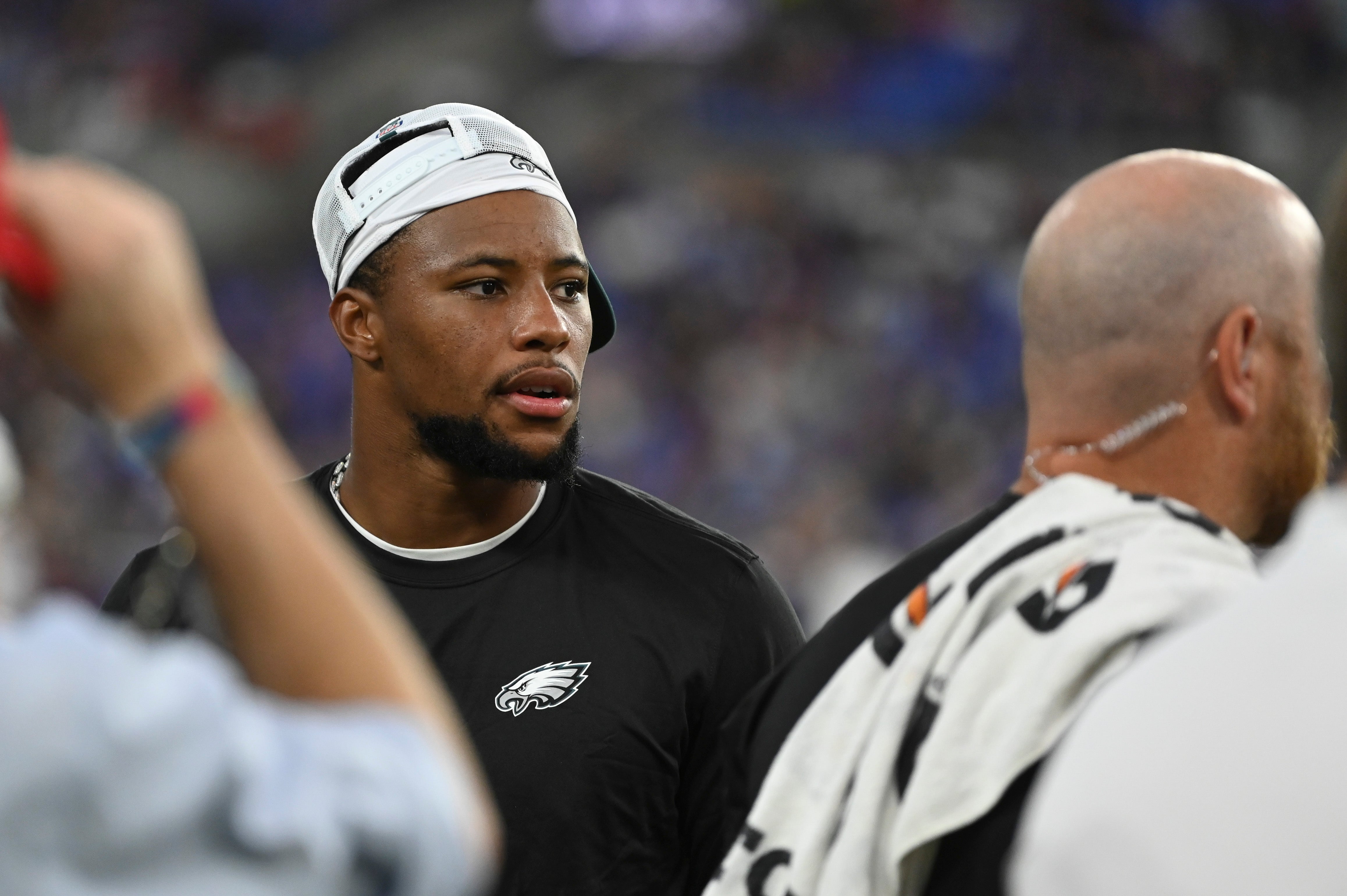 Philadelphia Eagles running back Saquon Barkley (26) stands on the sidelines during the first quarter of a preseason game against the Baltimore Ravens at M&T Bank Stadium.