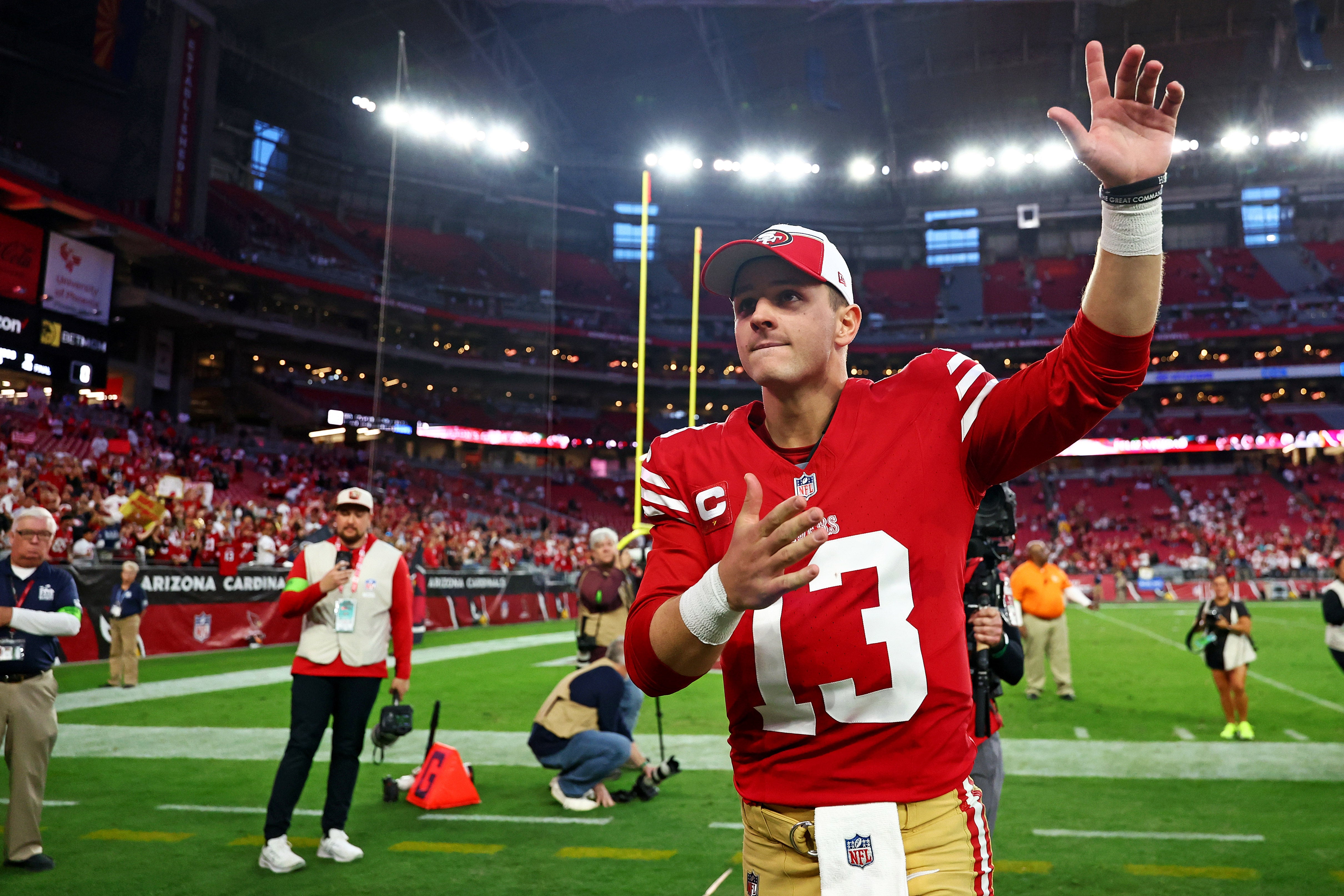 Dec 17, 2023; Glendale, Arizona, USA; San Francisco 49ers quarterback Brock Purdy (13) celebrates after beating the Arizona Cardinals at State Farm Stadium.