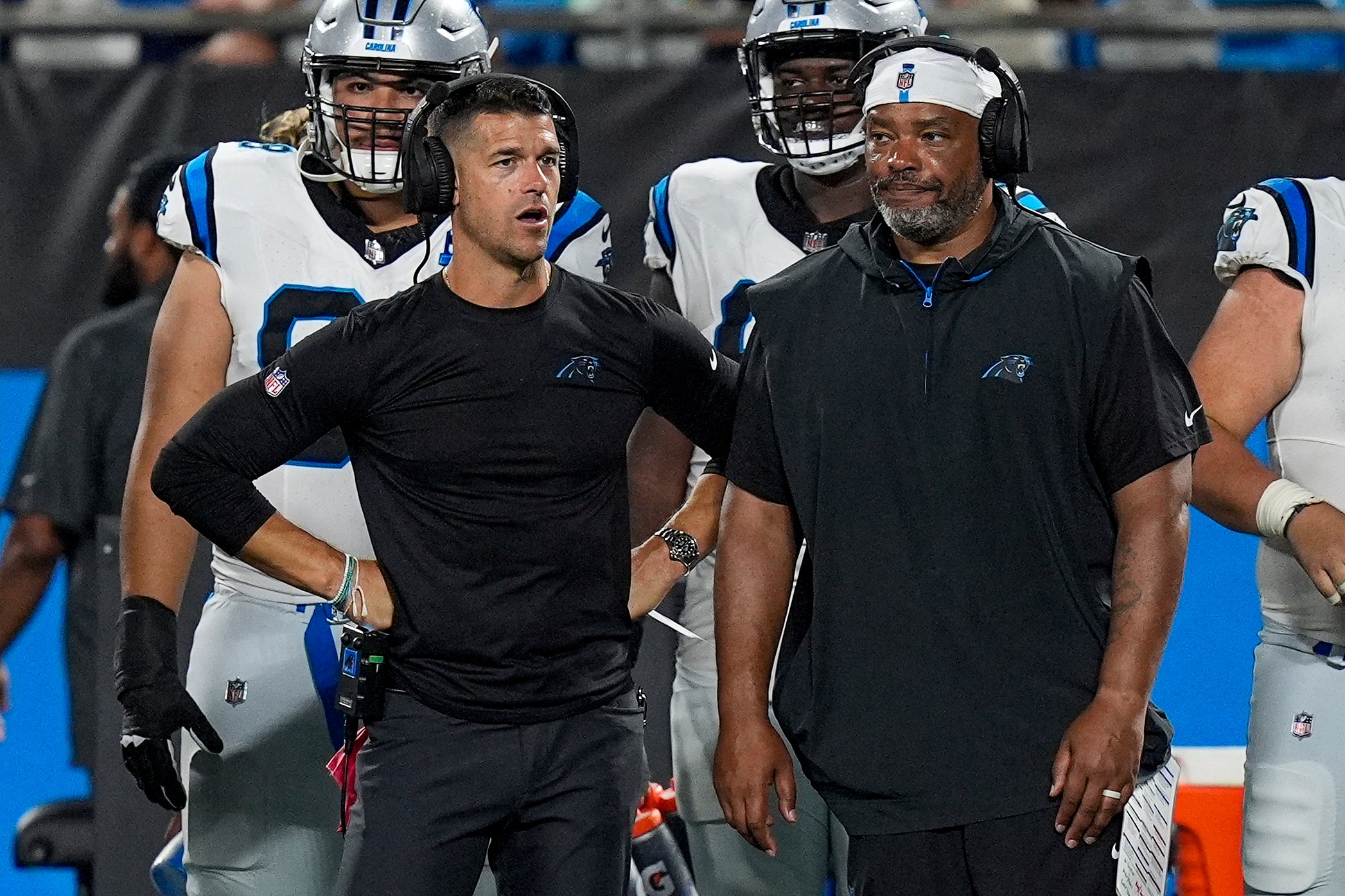 Aug 17, 2024; Charlotte, North Carolina, USA; Carolina Panthers head coach Dave Canales talks with offensive coach Harold Goodwin during the second half against the New York Jets at Bank of America Stadium. Mandatory Credit: Jim Dedmon-USA TODAY Sports