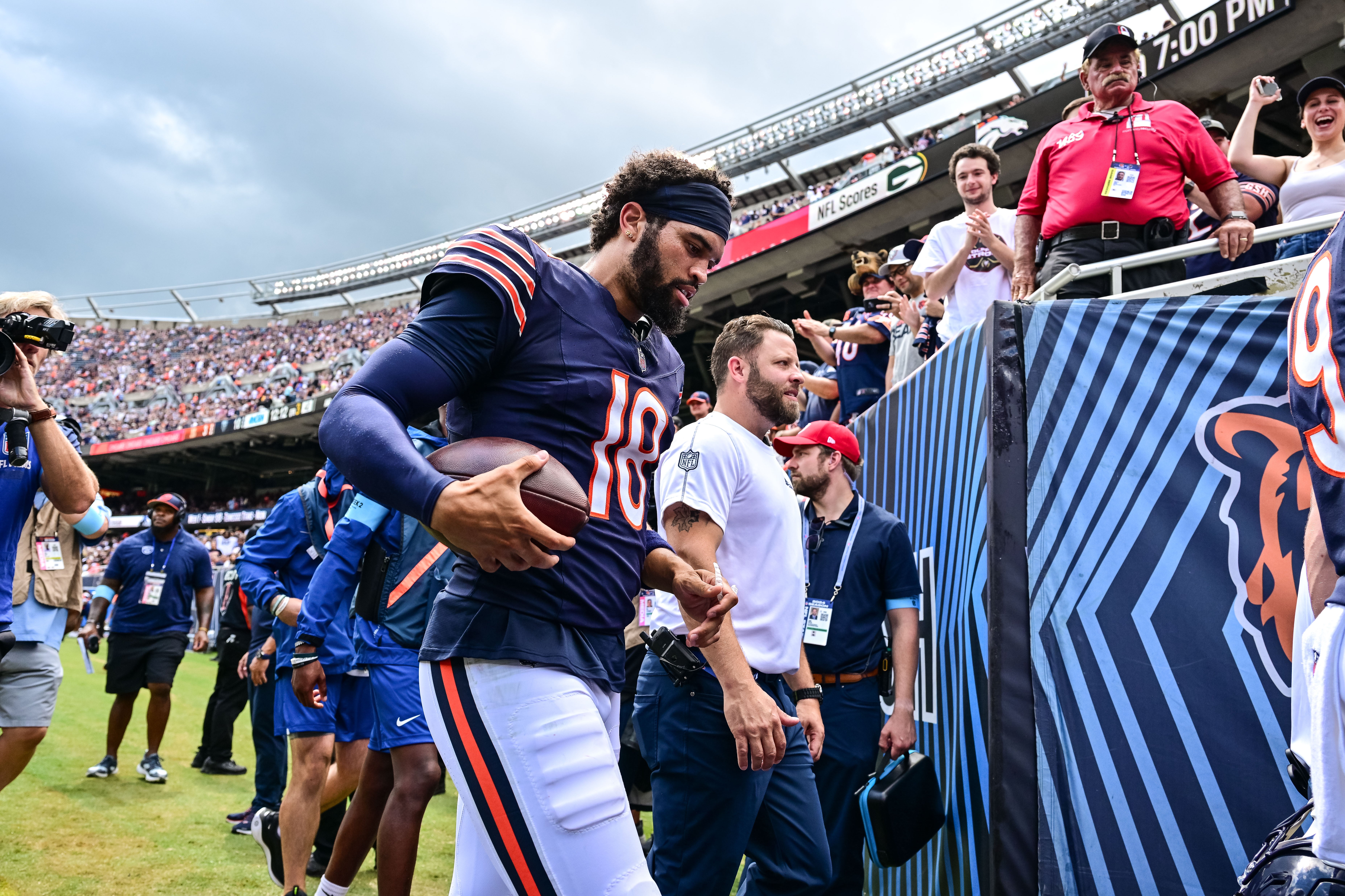 Aug 17, 2024; Chicago, Illinois, USA; Chicago Bears quarterback Caleb Williams (18) walks off the field against the Cincinnati Bengals at halftime at Soldier Field.