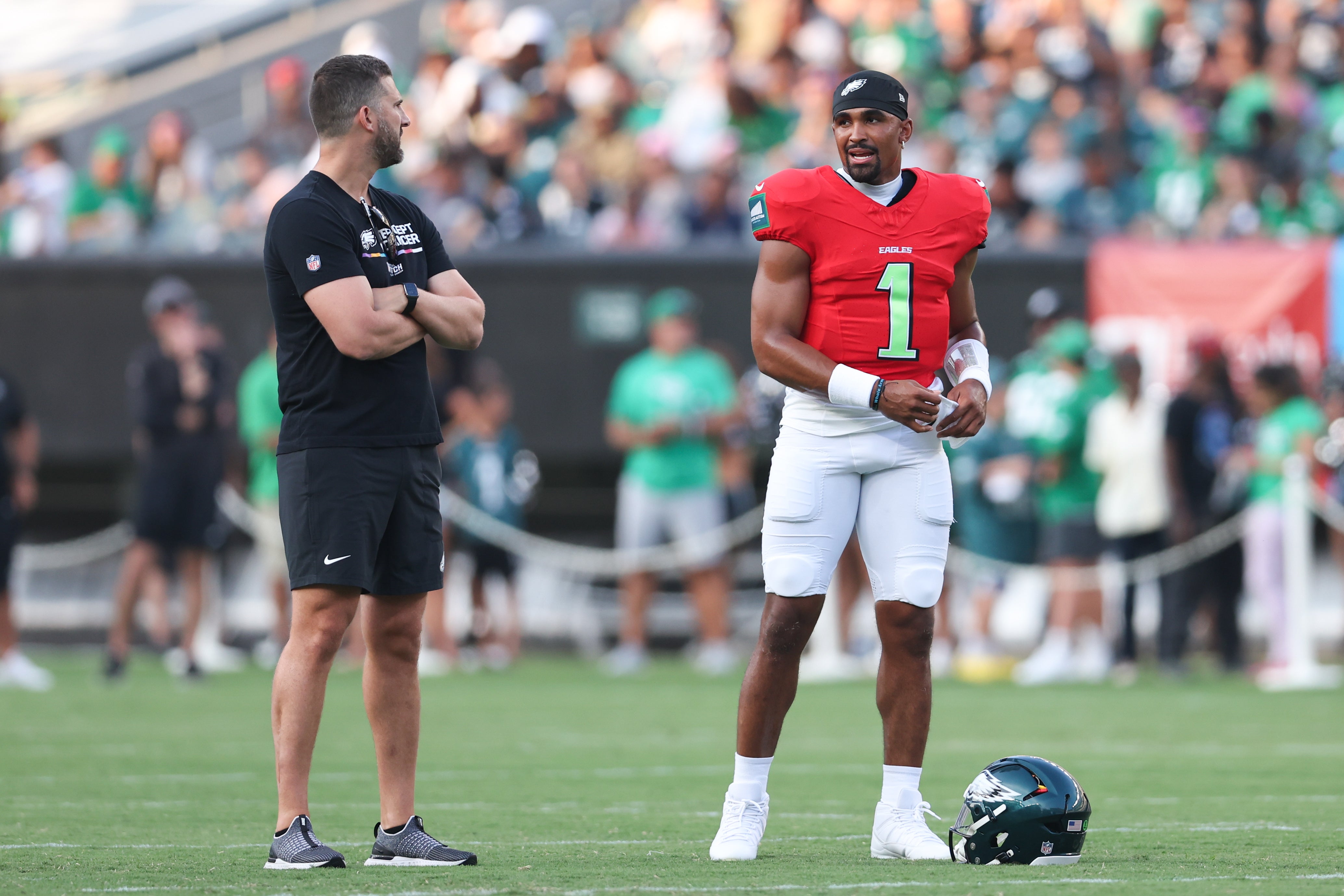 Philadelphia Eagles quarterback Jalen Hurts (1) talks with head coach Nick Sirianni (L) during a practice at Lincoln Financial Field.