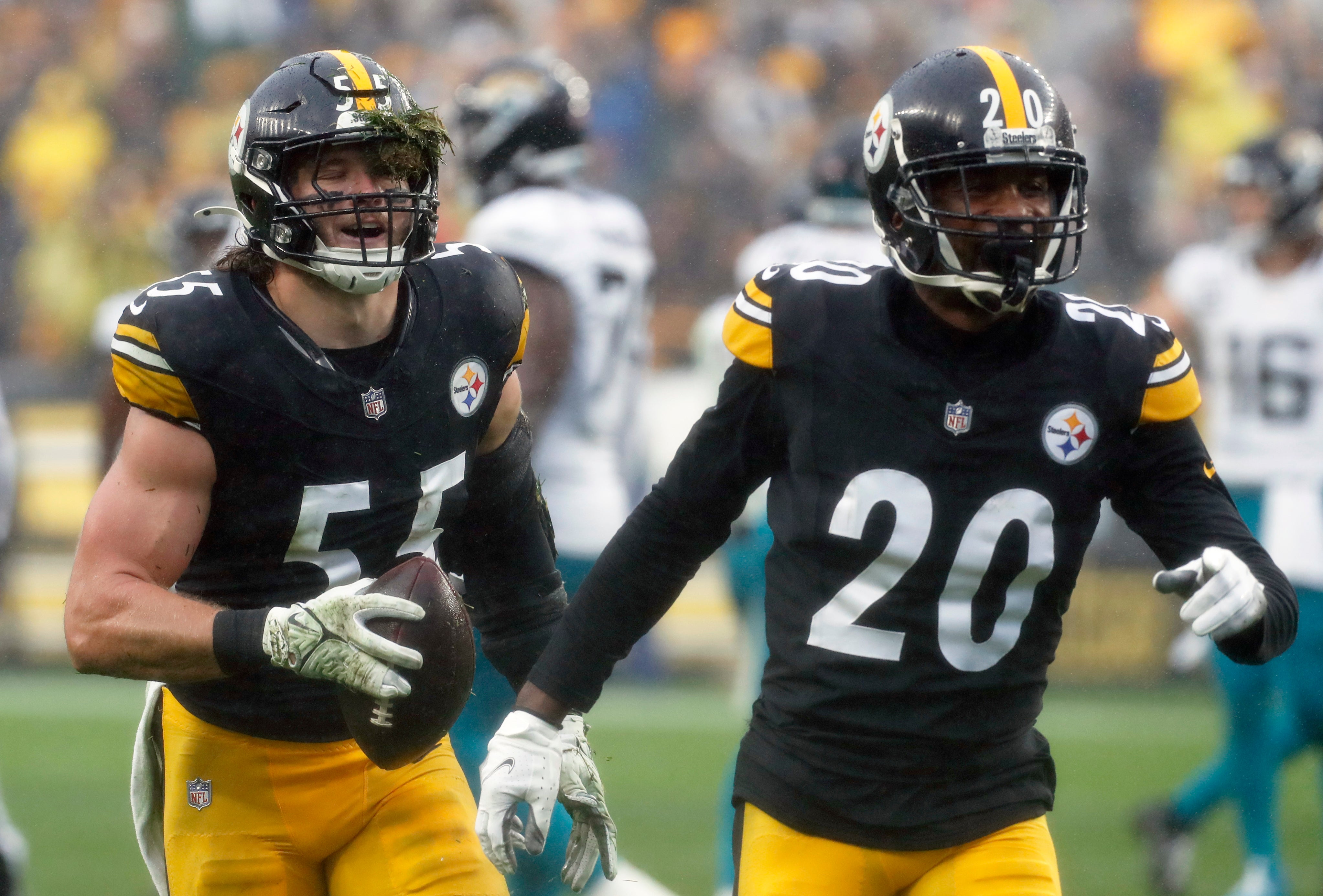 Oct 29, 2023; Pittsburgh, Pennsylvania, USA; Pittsburgh Steelers linebacker Cole Holcomb (55) and cornerback Patrick Peterson (20) celebrate a fumble recovery by Holcomb against the Jacksonville Jaguars during the first quarter at Acrisure Stadium. Mandatory Credit: Charles LeClaire-USA TODAY Sports