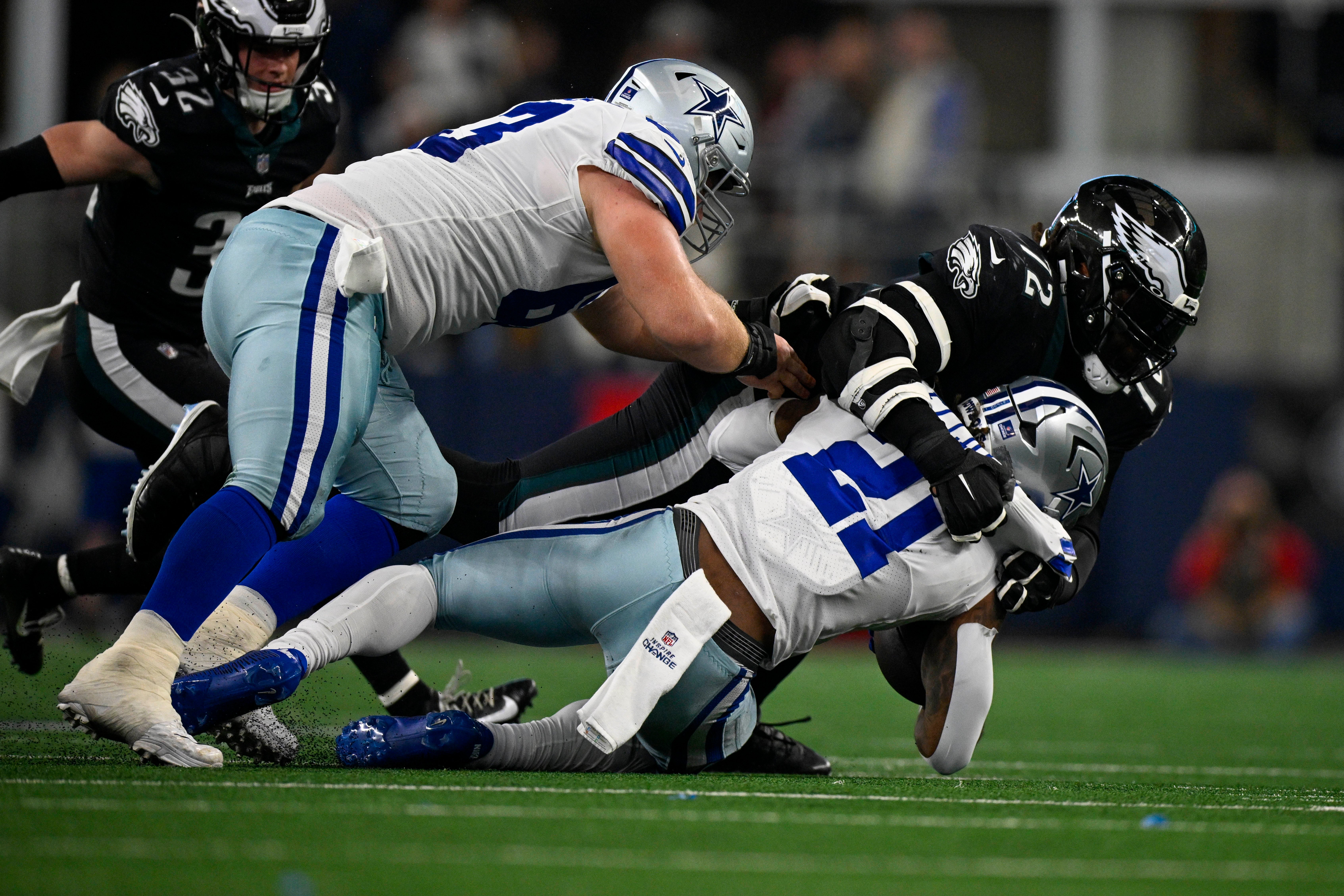 Philadelphia Eagles defensive tackle Linval Joseph (72) tackles Dallas Cowboys running back Ezekiel Elliott (21) during the second quarter at AT&T Stadium.