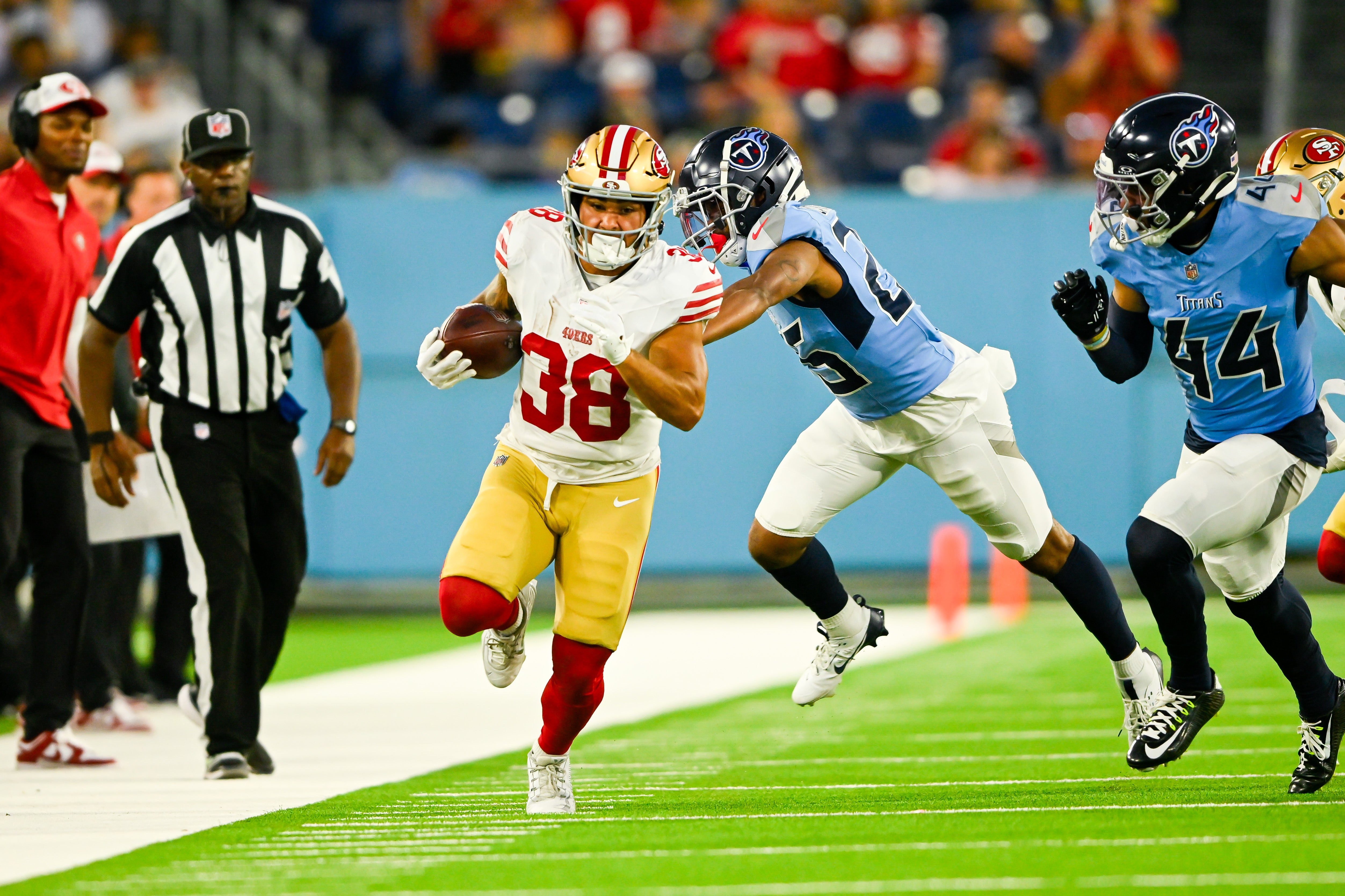 Aug 10, 2024; Nashville, Tennessee, USA; San Francisco 49ers running back Cody Schrader (38) runs the ball against the Tennessee Titans during the second half at Nissan Stadium.