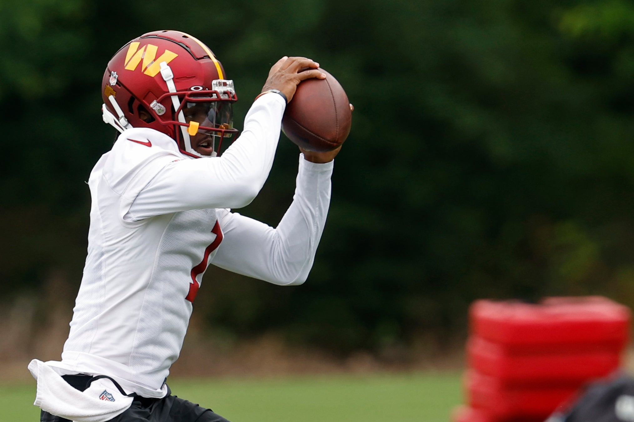 Jun 5, 2024; Ashburn, VA, USA; Washington Commanders wide receiver Jahan Dotson (1) catches a pass during OTA workouts at Commanders Park. Mandatory Credit: Geoff Burke-USA TODAY Sports