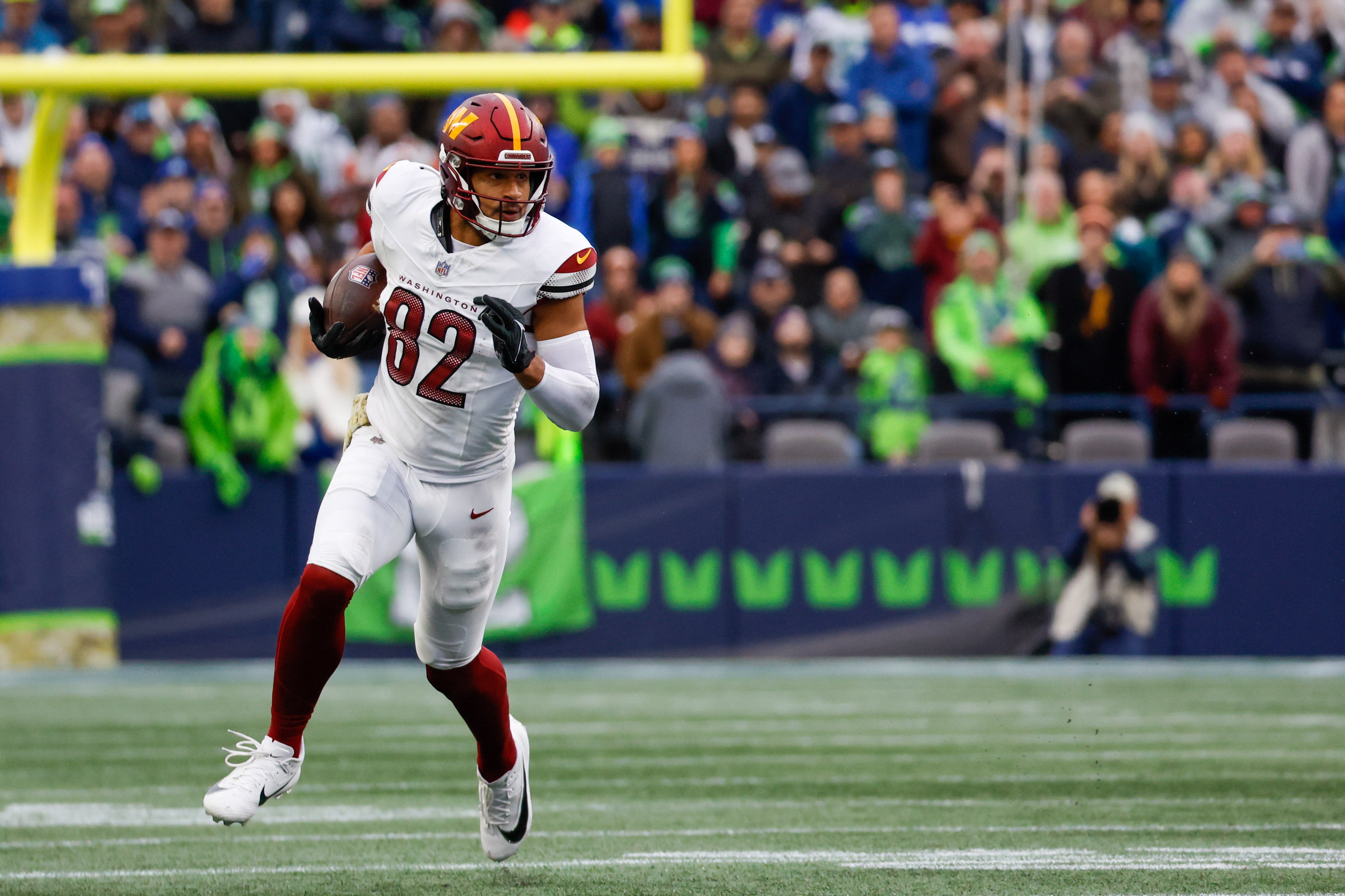 Nov 12, 2023; Seattle, Washington, USA; Washington Commanders tight end Logan Thomas (82) runs for yards after the catch against the Seattle Seahawks during the second quarter at Lumen Field.