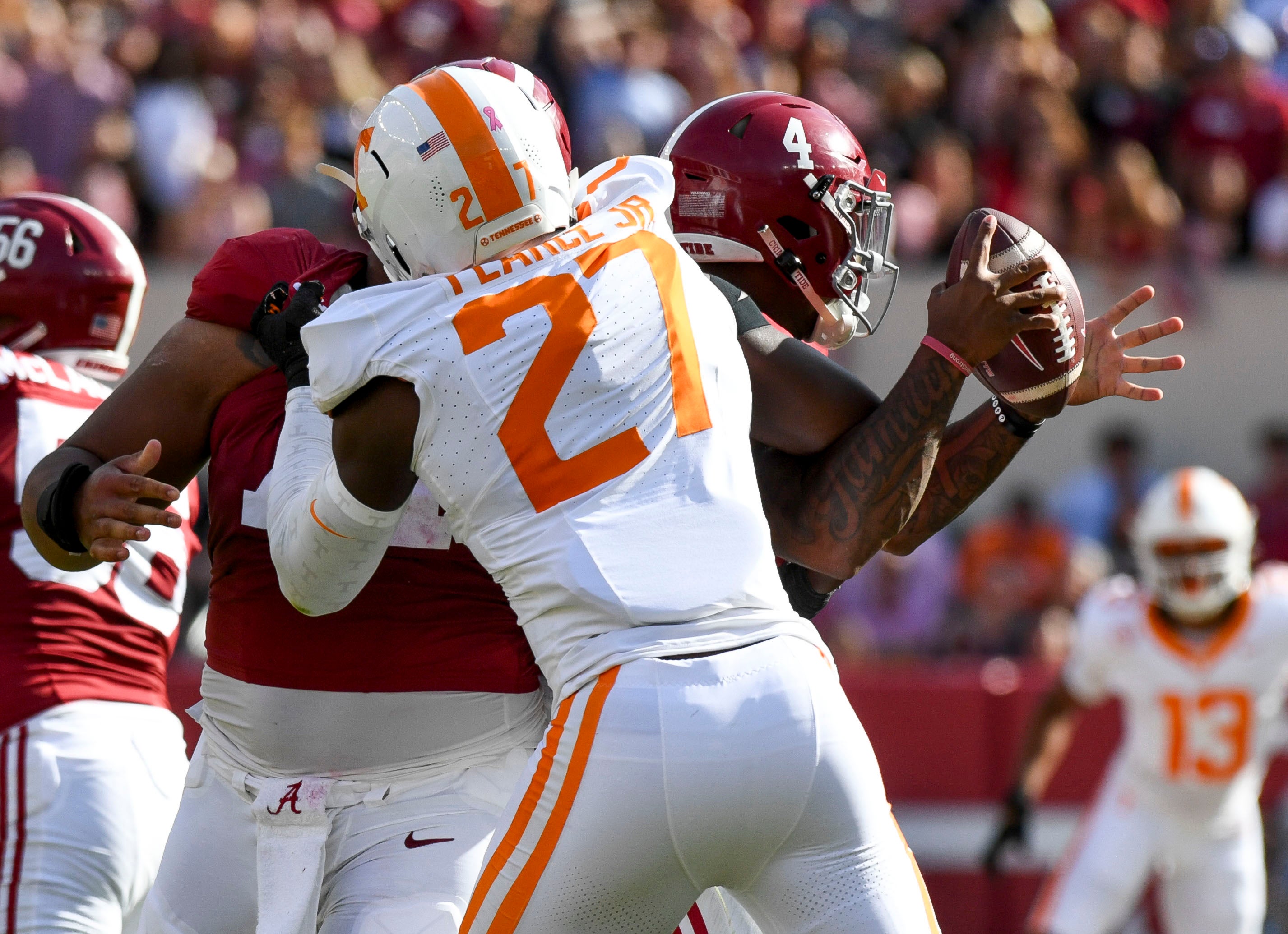 Oct 21, 2023; Tuscaloosa, Alabama, USA; Tennessee Volunteers defensive lineman James Pearce Jr. (27) causes a fumble by Alabama Crimson Tide quarterback Jalen Milroe (4) which Tennessee recovered at Bryant-Denny Stadium.