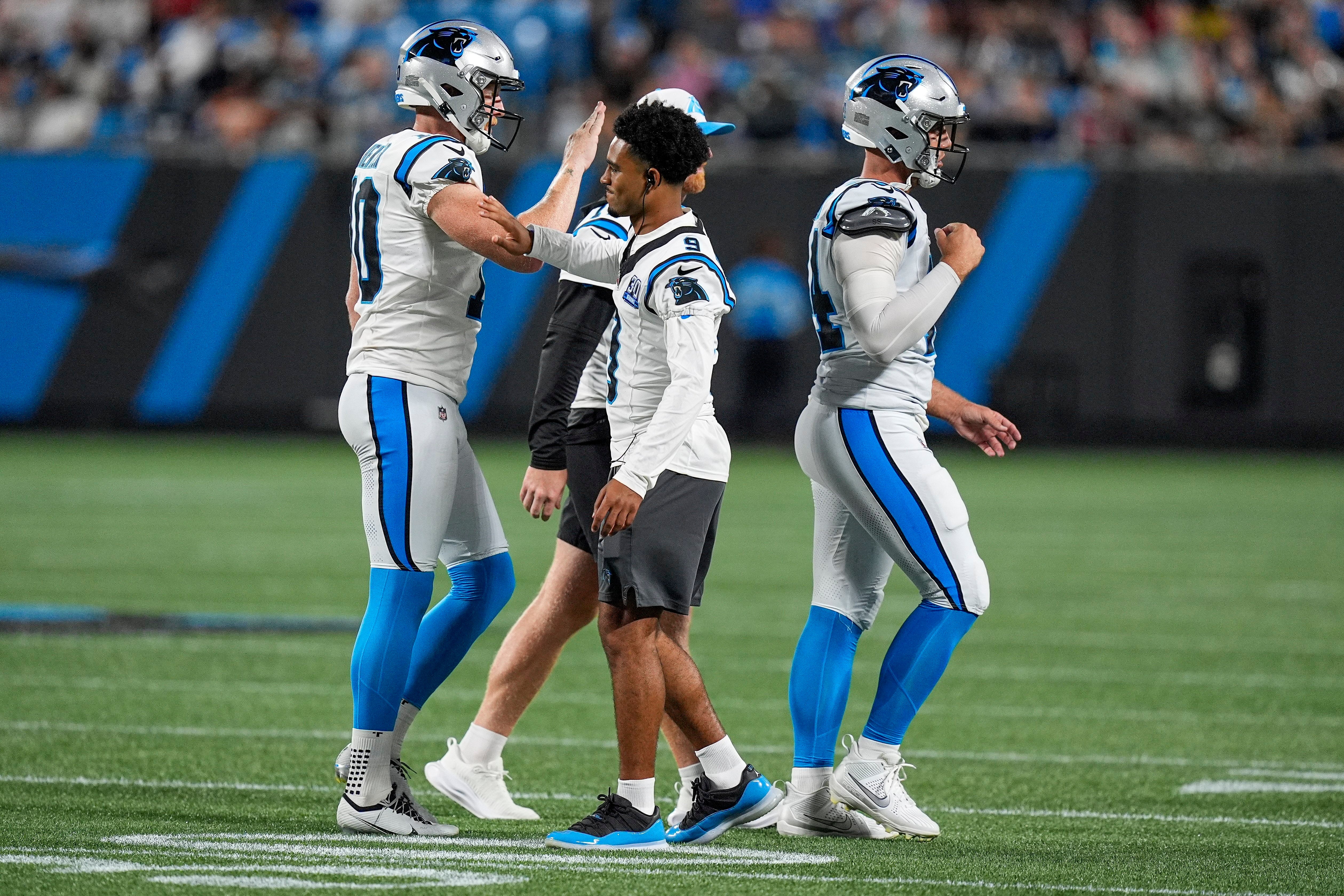 Aug 17, 2024; Charlotte, North Carolina, USA; Carolina Panthers quarterback Bryce Young (9) high fives his teammates after a field goal against the New York Jets during the second half at Bank of America Stadium. Mandatory Credit: Jim Dedmon-USA TODAY Sports