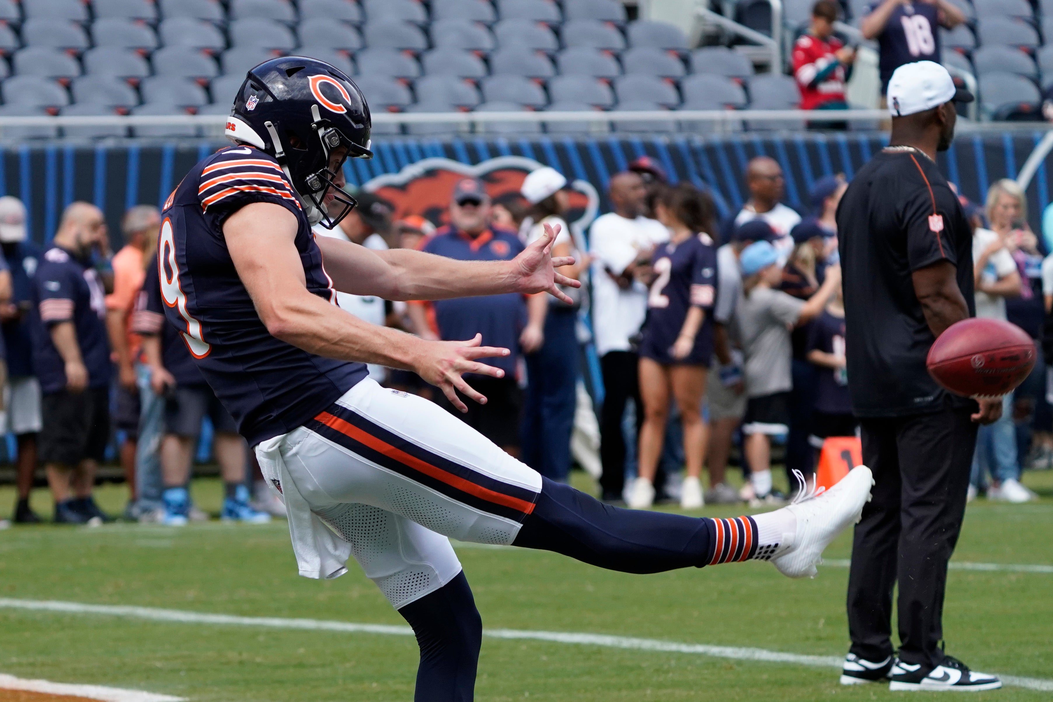 Aug 17, 2024; Chicago, Illinois, USA; Chicago Bears punter Tory Taylor (19) punts before the game against the Cincinnati Bengals at Soldier Field.