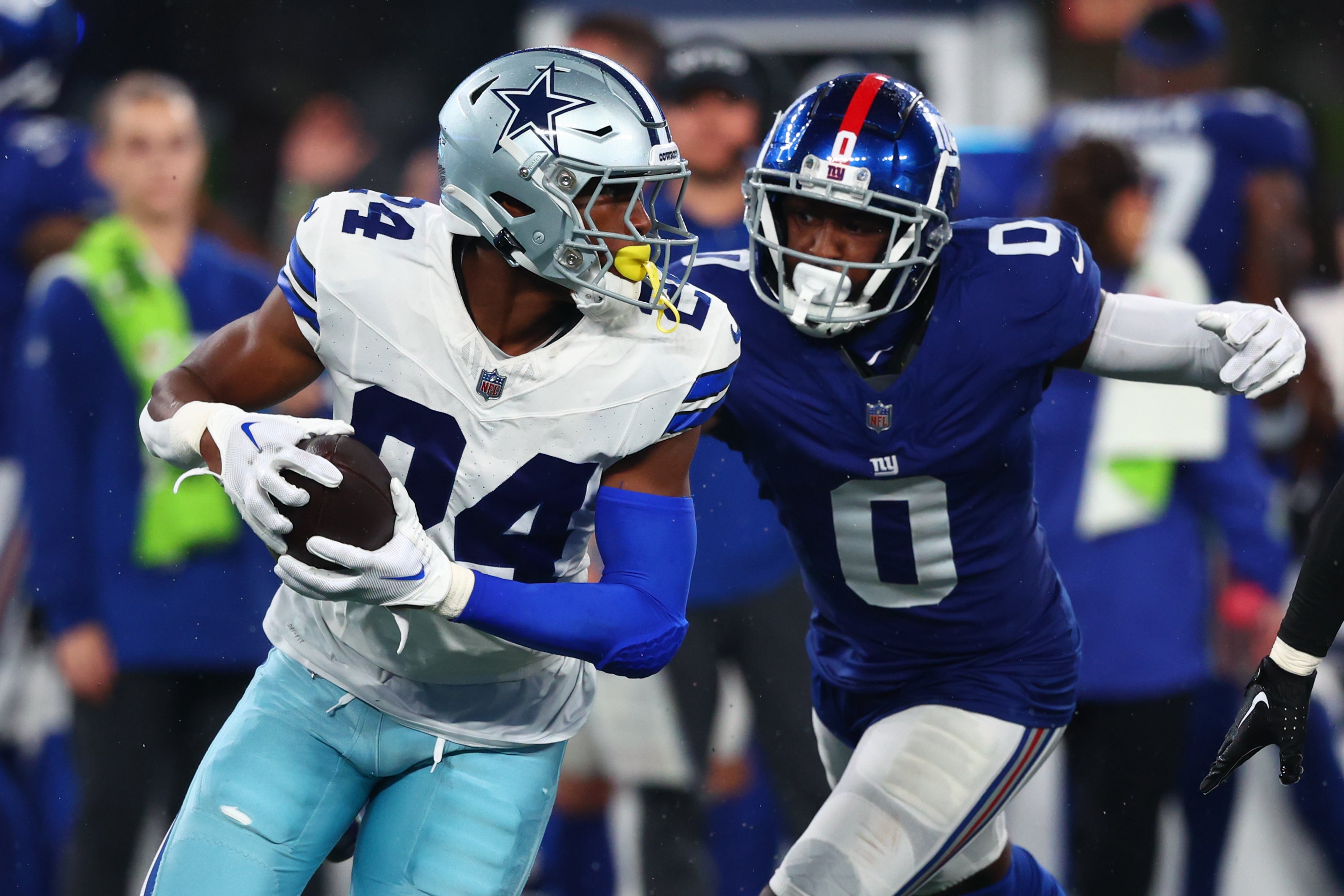 Dallas Cowboys safety Israel Mukuamu (24) returns a fumble recovery for a touchdown against the New York Giants during the second half at MetLife Stadium.