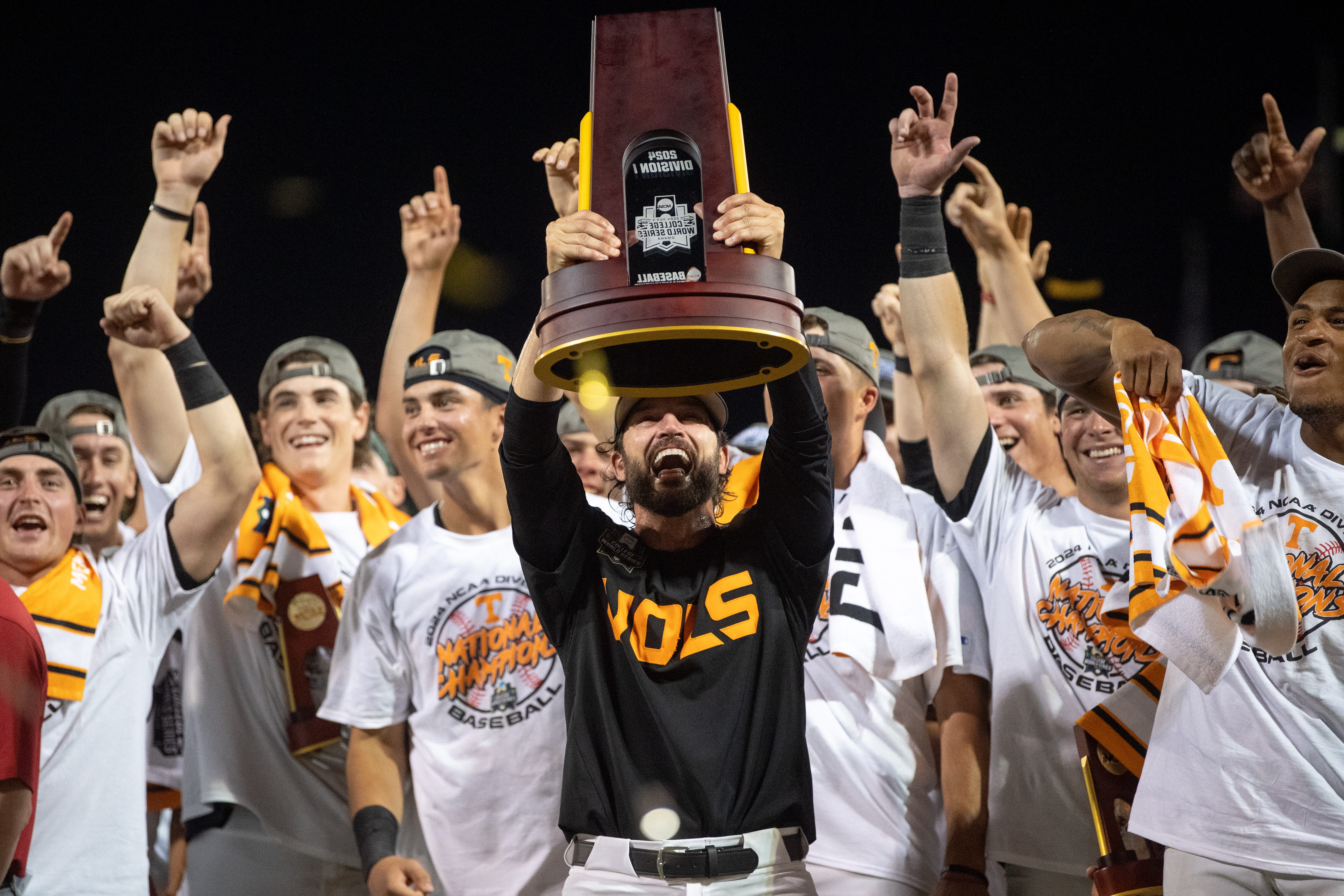 Tennessee head coach Tony Vitello holds up the trophy after game three of the NCAA College World Series finals between Tennessee and Texas A&M at Charles Schwab Field in Omaha, Neb., on Monday, June 24, 2024.