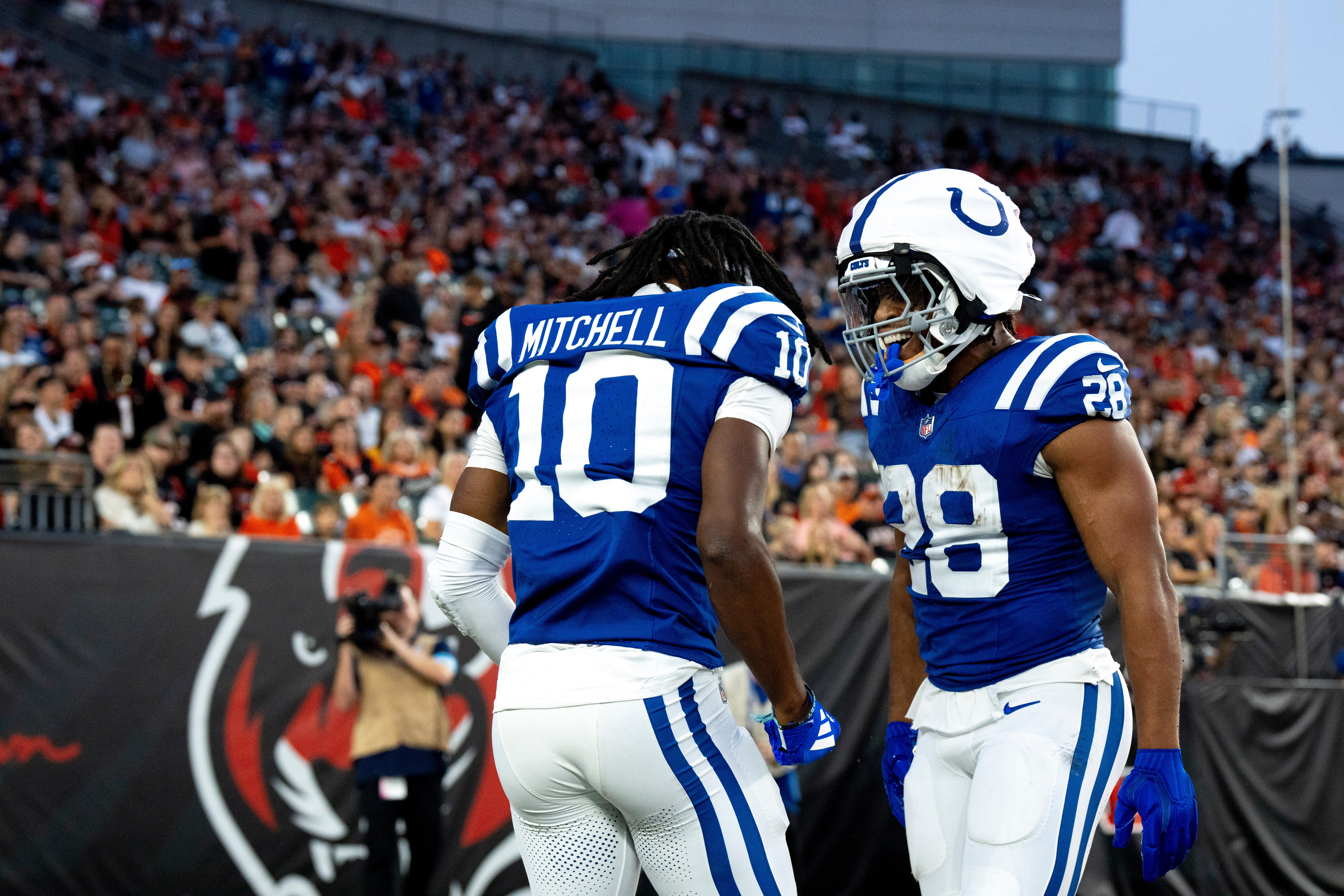 Indianapolis Colts running back Jonathan Taylor (28) and Indianapolis Colts wide receiver Adonai Mitchell (10) celebrate after scoring a touchdown in the first quarter between the Cincinnati Bengals and the Indianapolis Colts at Paycor Stadium in Cincinnati on Thursday, Aug. 22, 2024.