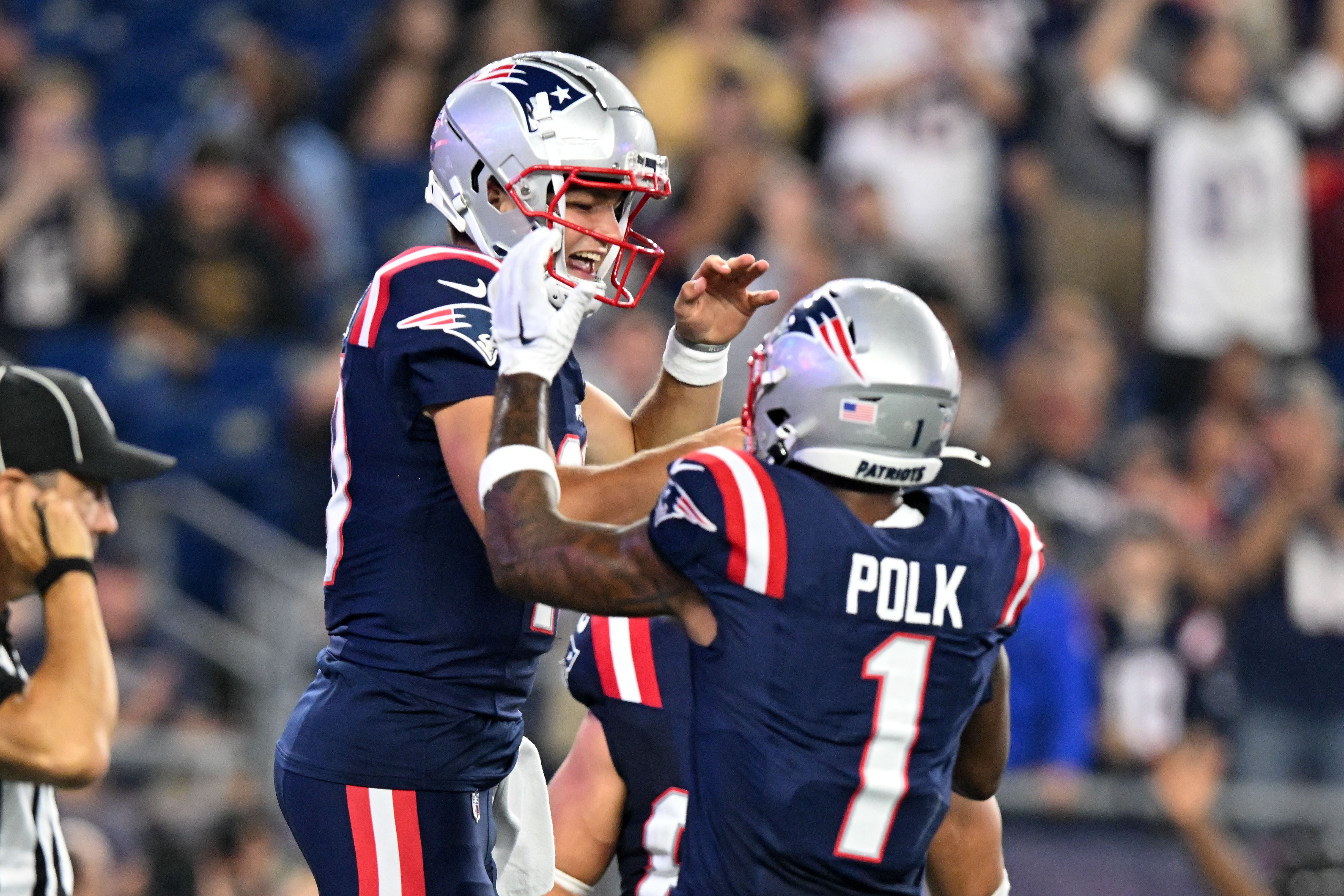 Aug 15, 2024; Foxborough, Massachusetts, USA; New England Patriots quarterback Drake Maye (10) celebrates with wide receiver Ja'Lynn Polk (1) after scoring a touchdown against the Philadelphia Eagles during the first half at Gillette Stadium.