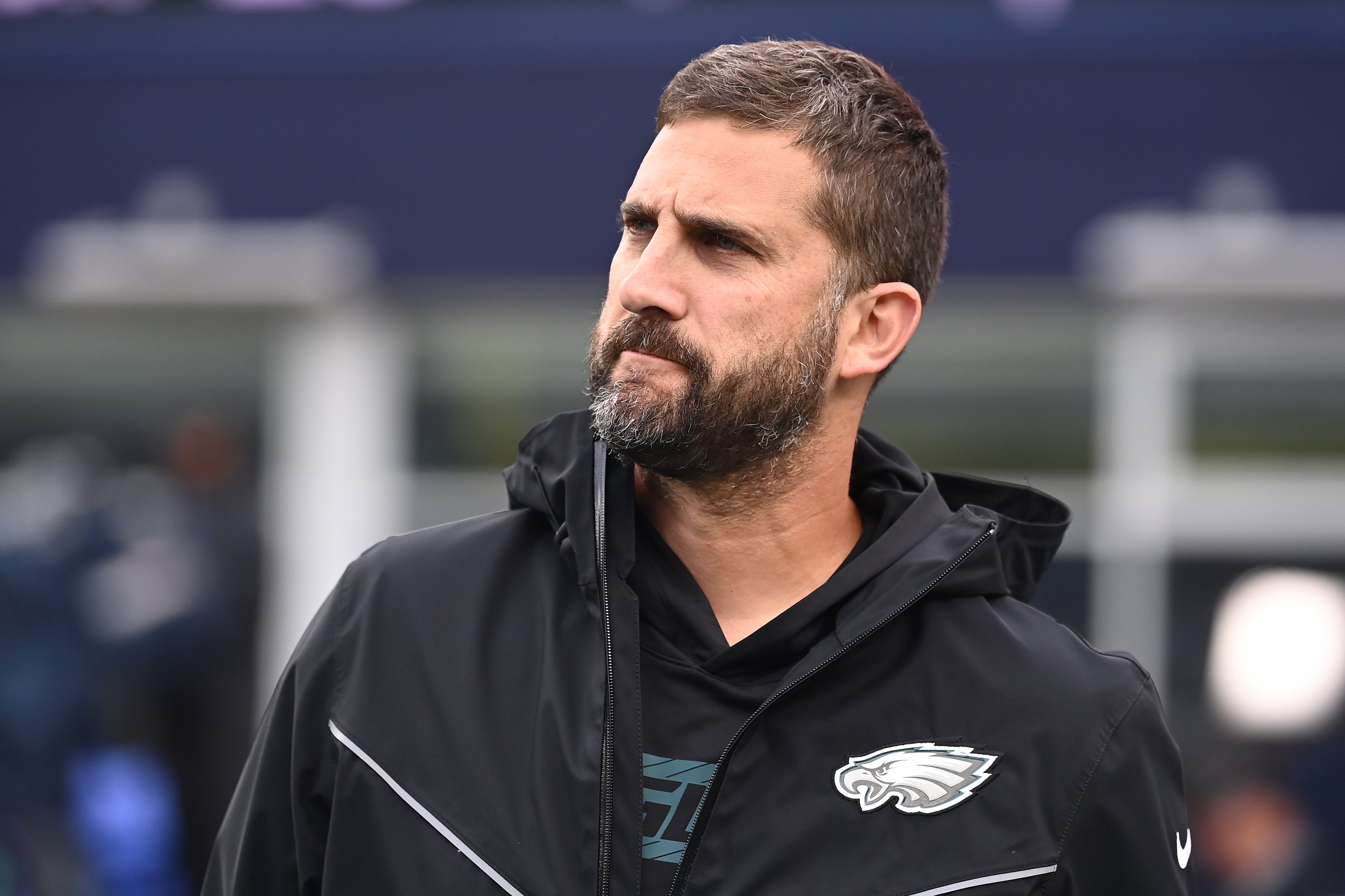 Philadelphia Eagles head coach Nick Sirianni watches the team warm up before a game against the New England Patriots at Gillette Stadium.