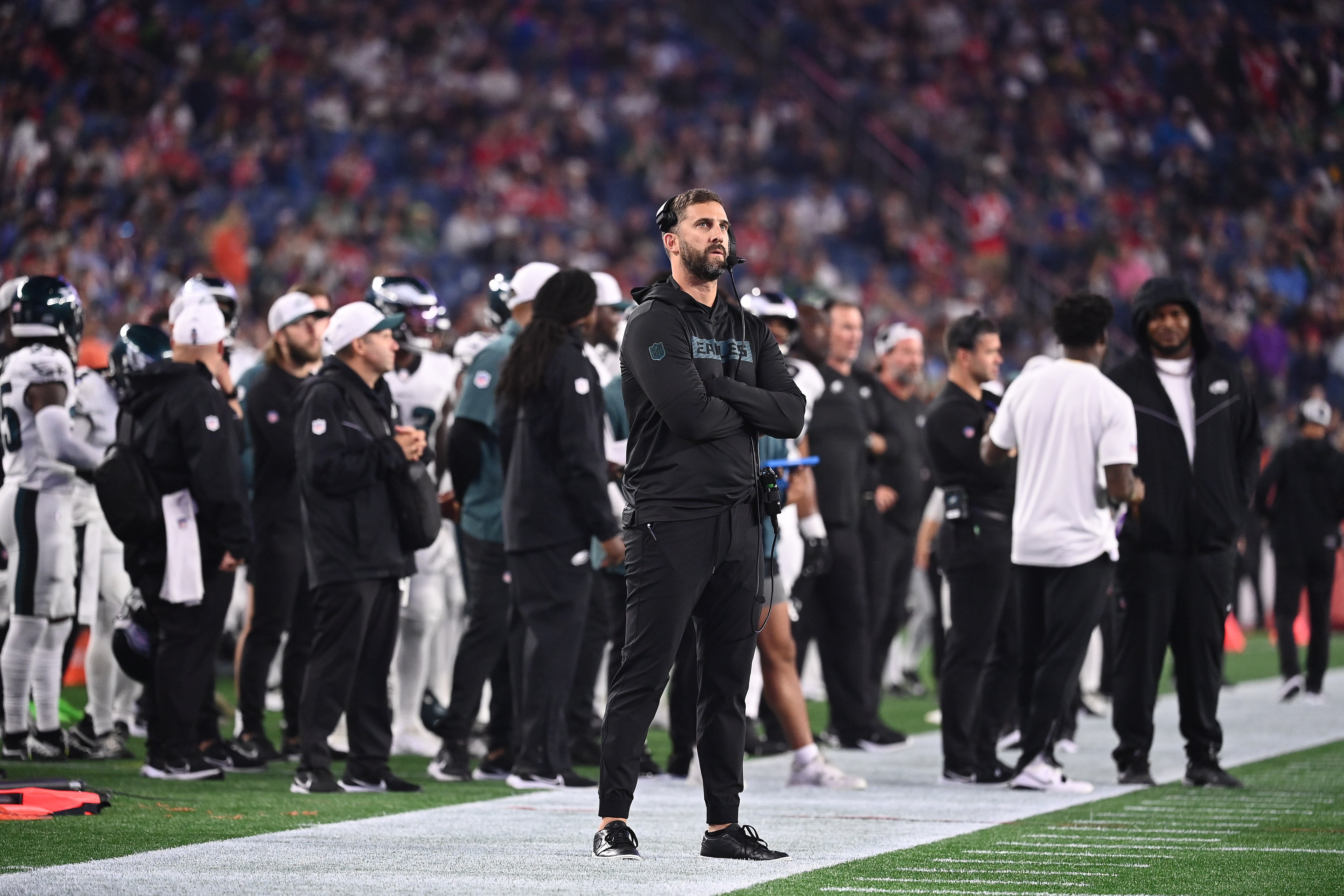 Philadelphia Eagles head coach Nick Sirianni watches the in stadium display during the first half against the New England Patriots at Gillette Stadium.