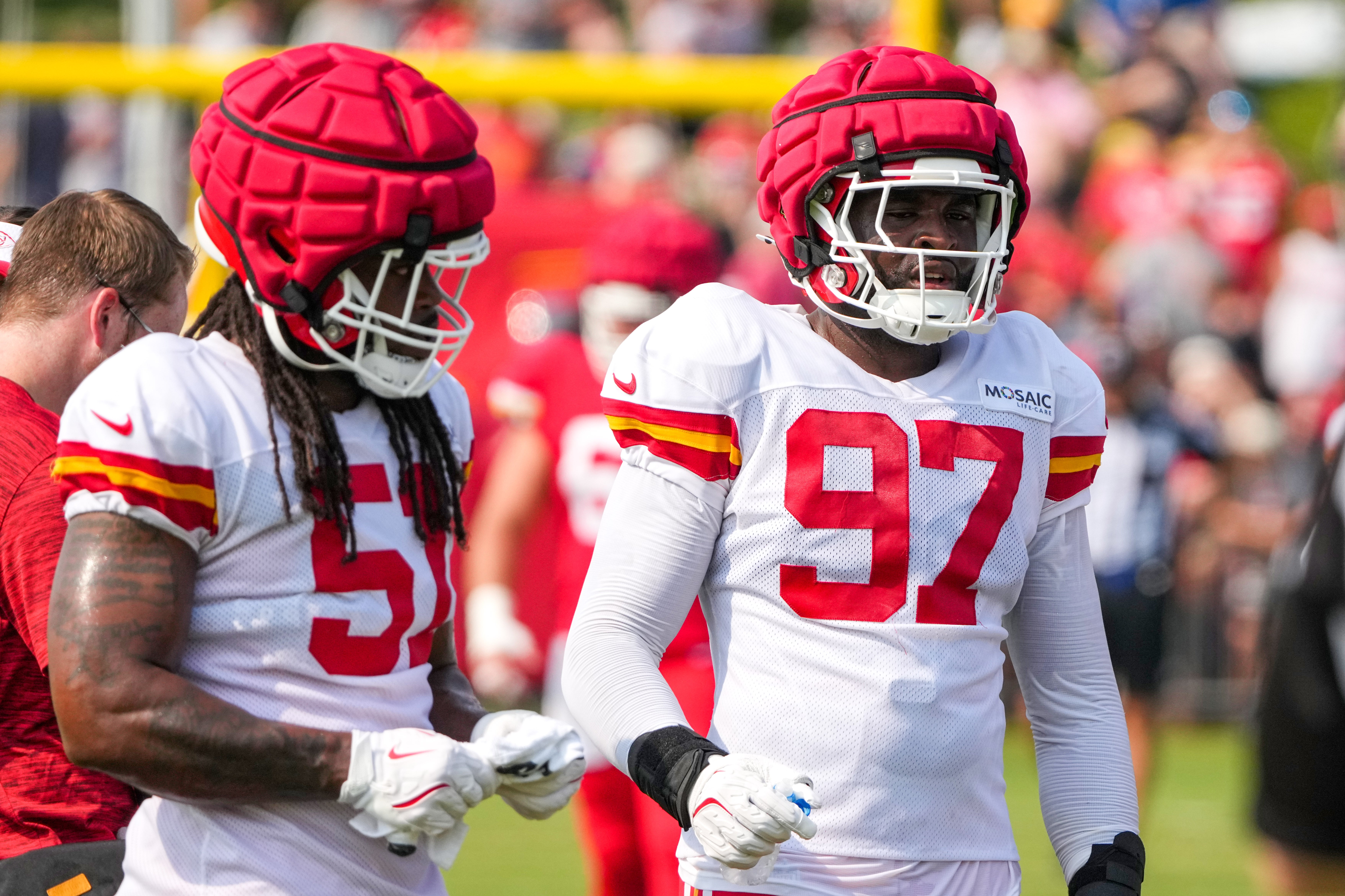 Jul 26, 2024; Kansas City, MO, USA; Kansas City Chiefs defensive end Mike Danna (51) and defensive end Felix Anudike-Uzomah (97) pause while running drills during training camp at Missouri Western State University.