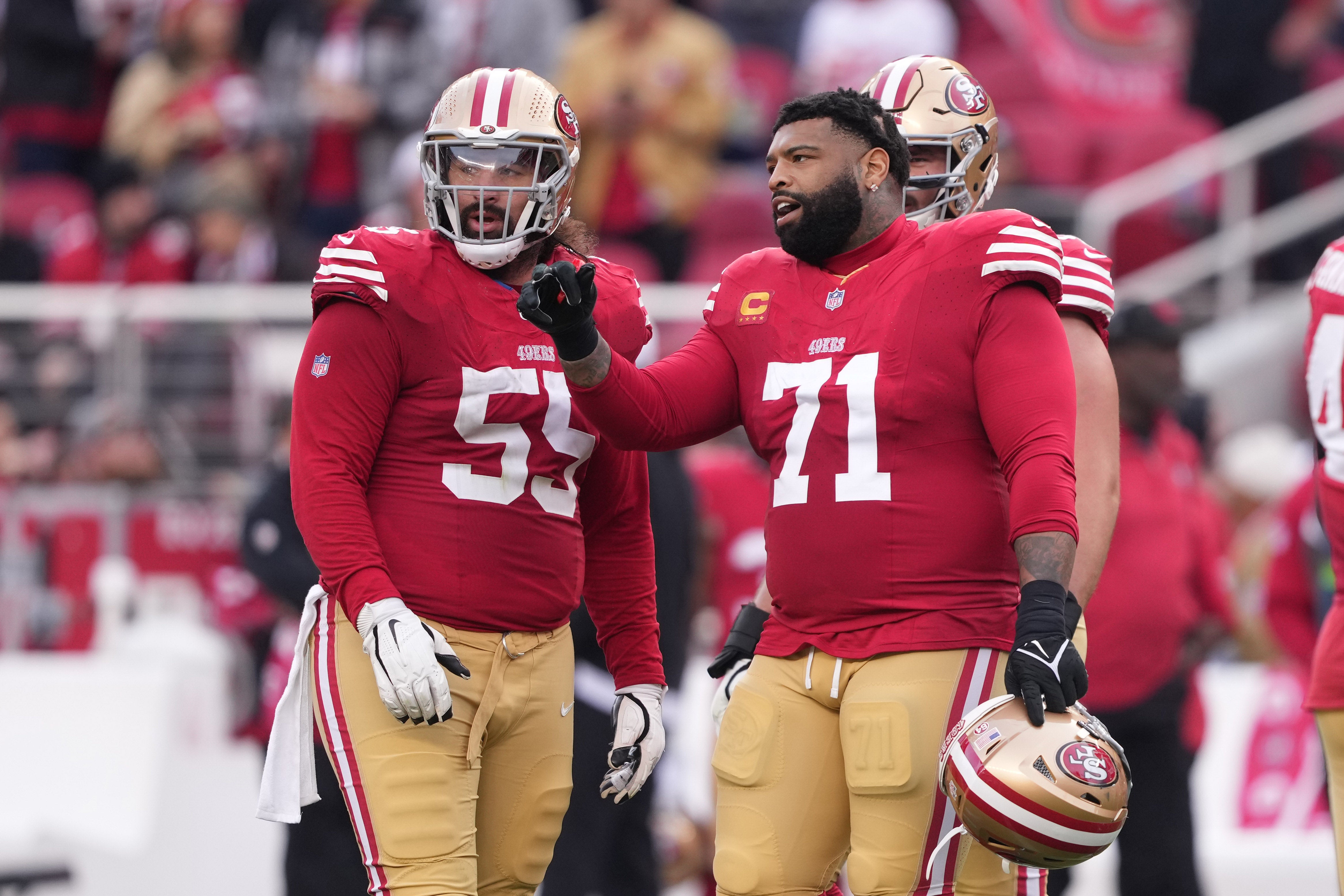 Dec 10, 2023; Santa Clara, California, USA; San Francisco 49ers offensive tackle Trent Williams (71) talks with guard Jon Feliciano (55) during the third quarter against the Seattle Seahawks at Levi's Stadium.