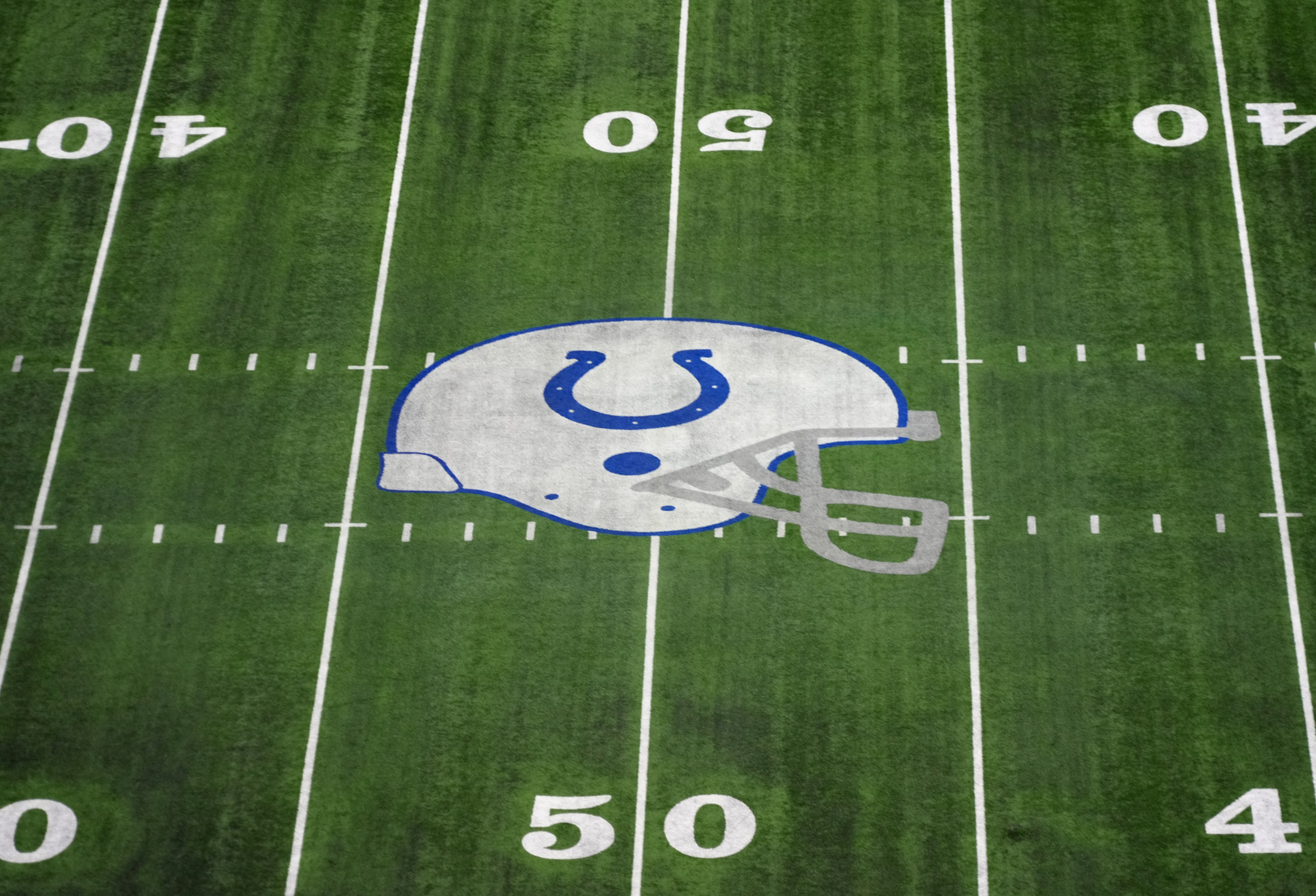 Feb 28, 2024; Indianapolis, IN, USA; The Indianapolis Colts helmet logo at midfield of Lucas Oil Stadium.