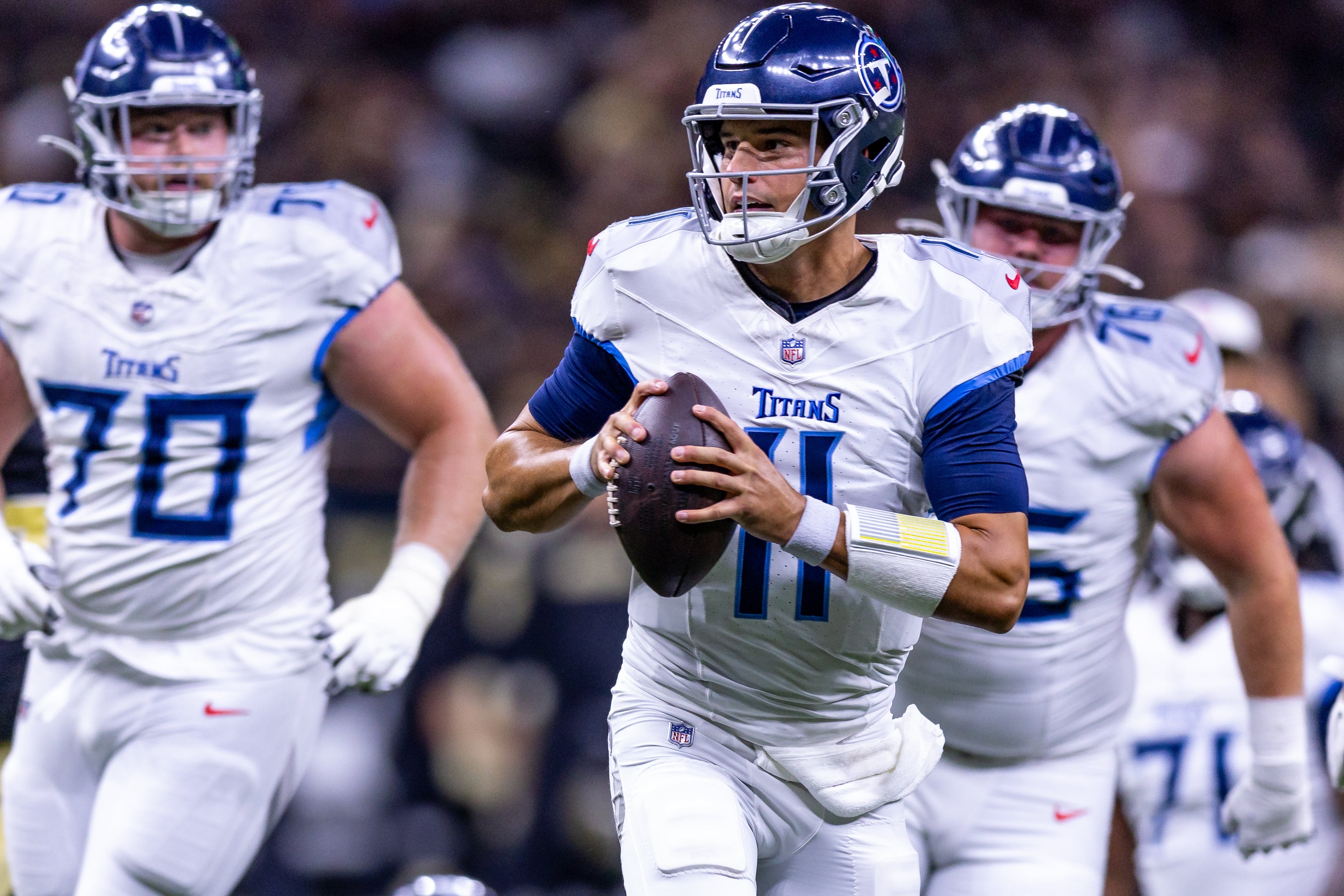 Tennessee Titans quarterback Mason Rudolph (11) scrambles out the pocket against the New Orleans Saints during the second half at Caesars Superdome. Stephen Lew-USA TODAY Sports
