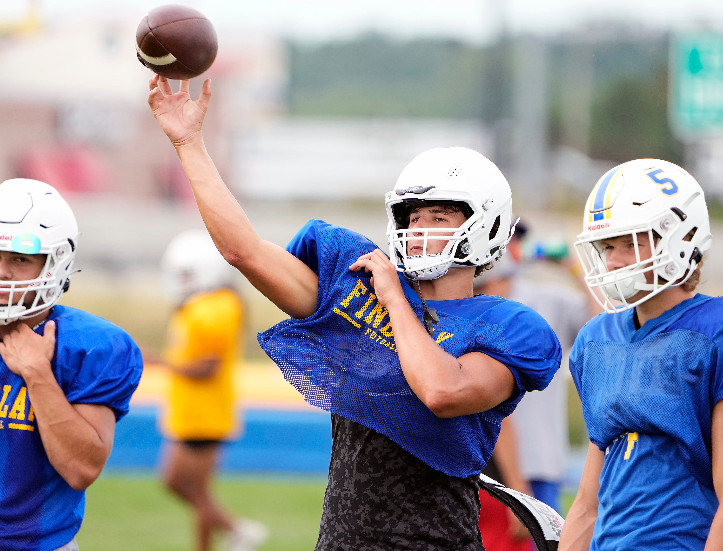 Findlay quarterback Ryan Montgomery looks to throw the ball during practice at Findlay High School on August 4, 2022. Ryan's brother Luke is an offensive linemen committed to Ohio State.