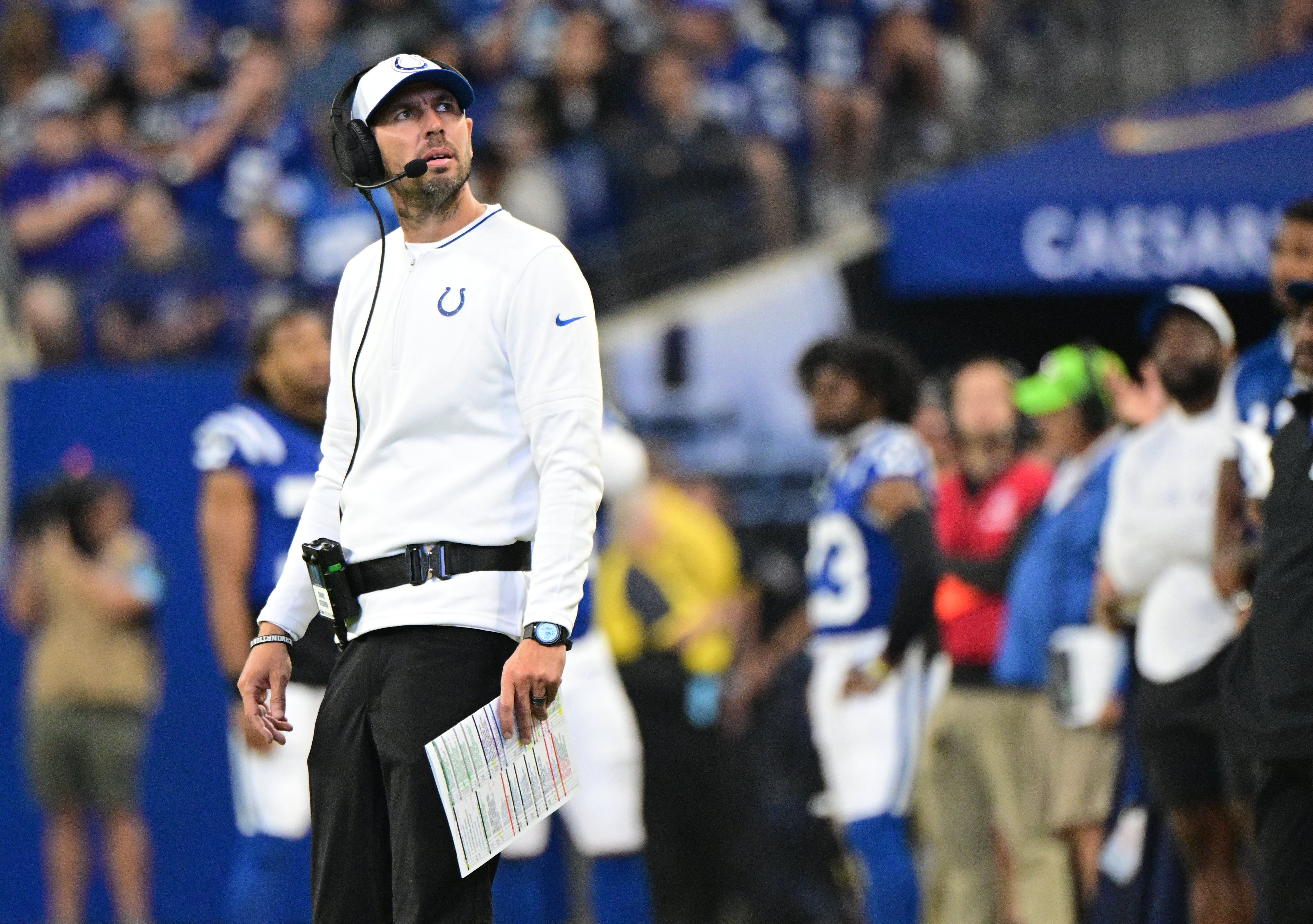 Aug 11, 2024; Indianapolis, Indiana, USA; Indianapolis Colts head coach Shane Steichen looks up at the replay during the second half against the Denver Broncos at Lucas Oil Stadium.