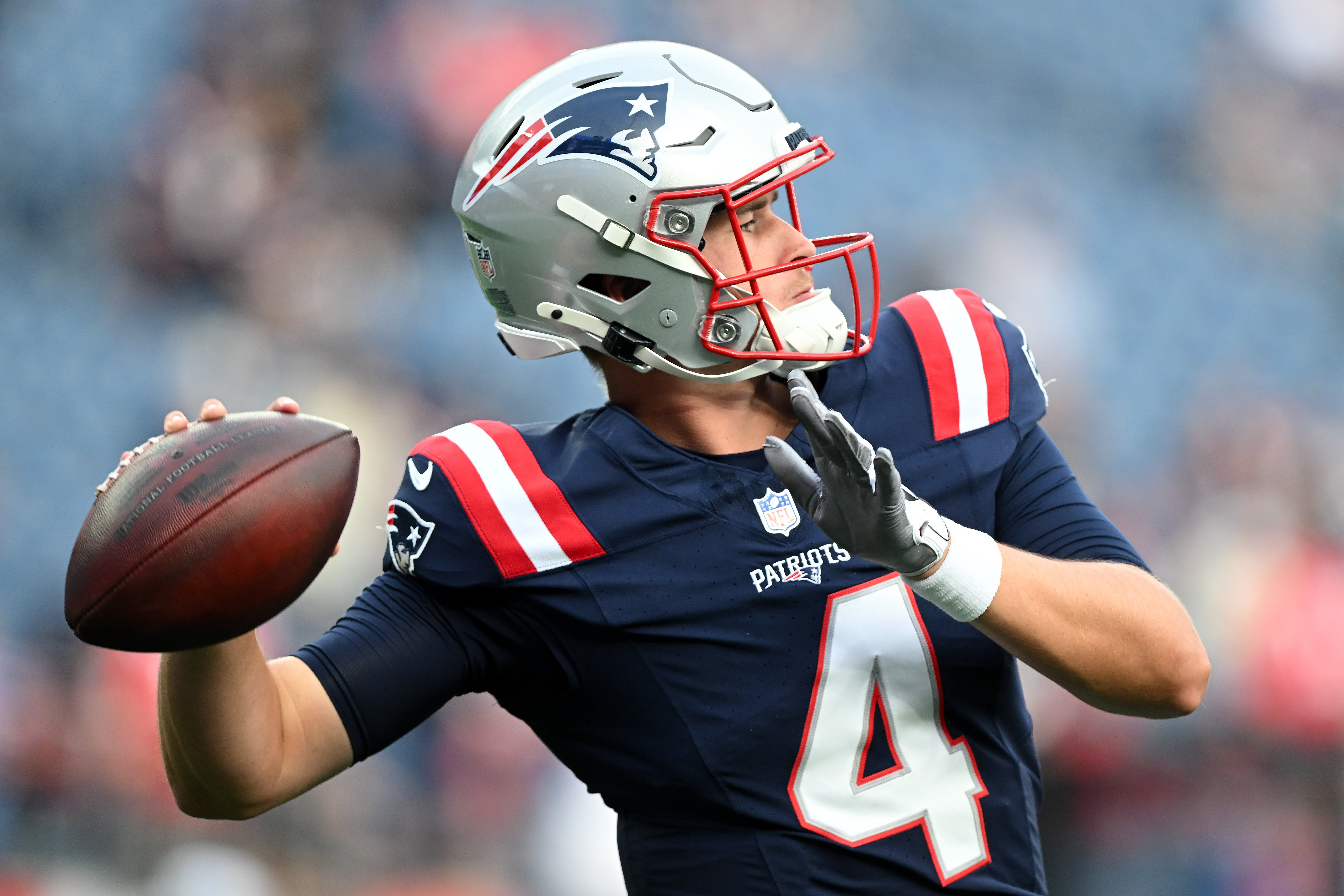 Aug 15, 2024; Foxborough, Massachusetts, USA; New England Patriots quarterback Bailey Zappe (4) throws the ball before a game against the Philadelphia Eagles at Gillette Stadium.