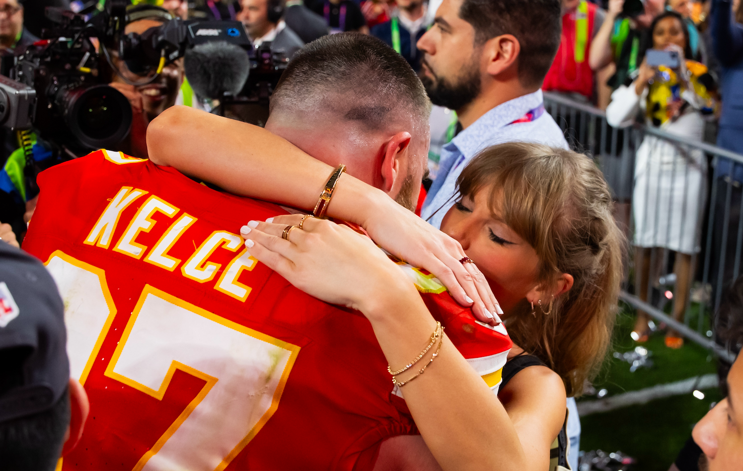 Feb 11, 2024; Paradise, Nevada, USA; Kansas City Chiefs tight end Travis Kelce (87) celebrates with girlfriend Taylor Swift after defeating the San Francisco 49ers in Super Bowl LVIII at Allegiant Stadium.