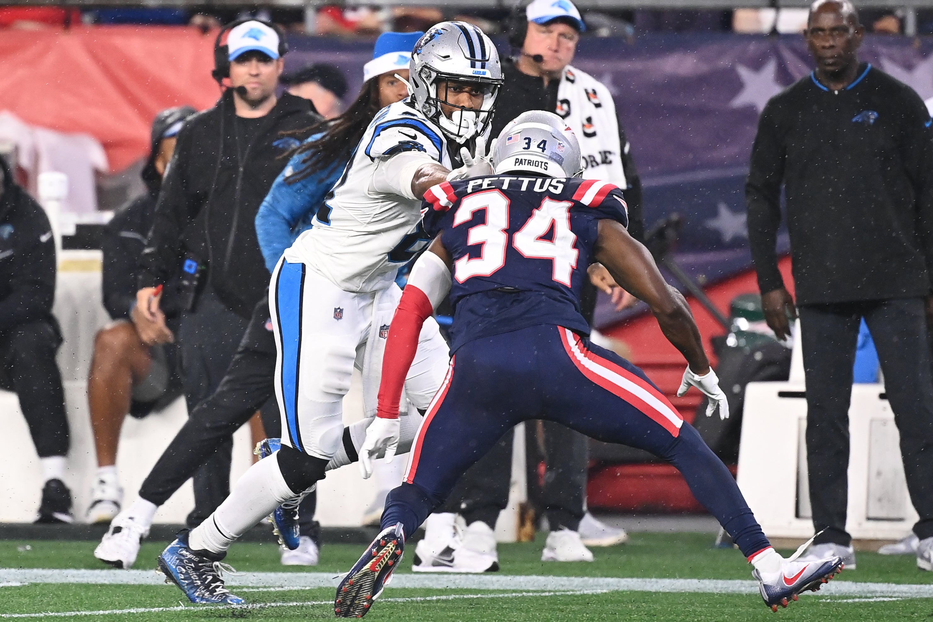 August 8, 2024; Foxborough, MA, USA; Carolina Panthers tight end Jordan Matthews (81) stiff arms New England Patriots safety Dell Pettus (34) during the first half at Gillette Stadium.