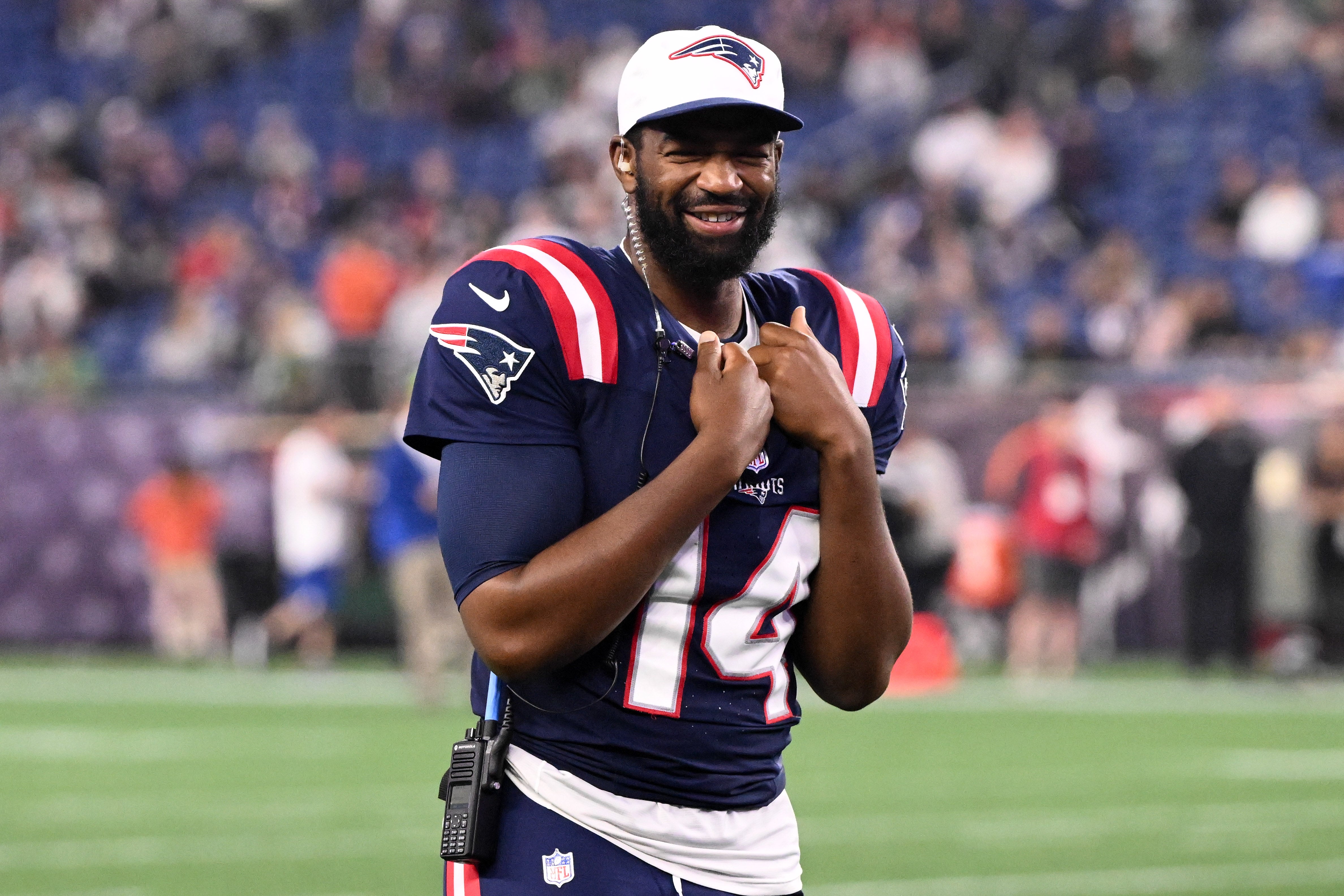 Aug 15, 2024; Foxborough, Massachusetts, USA; New England Patriots quarterback Jacoby Brissett (14) walks onto the field during a timeout against the Philadelphia Eagles in the second half at Gillette Stadium.
