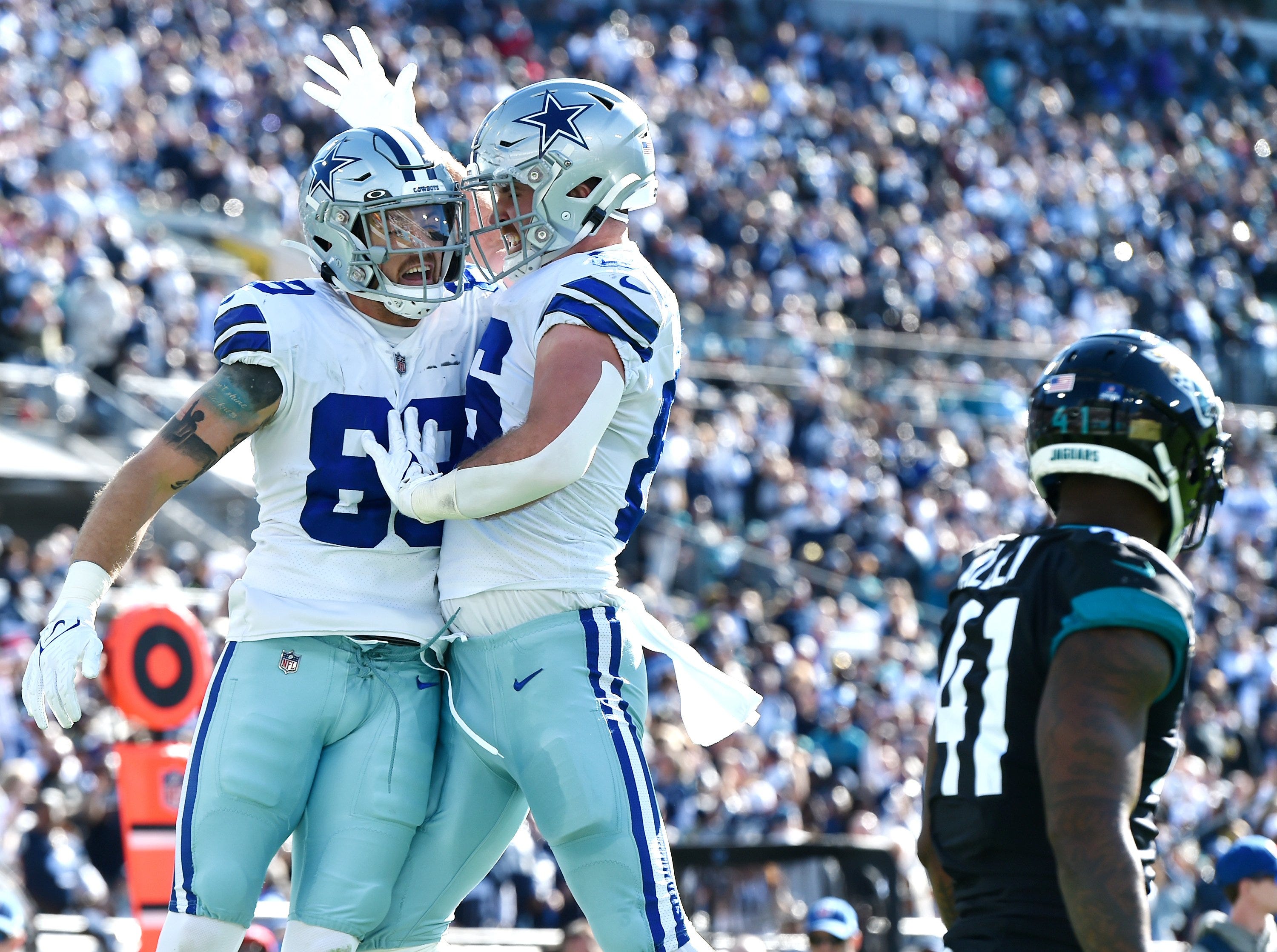 Dallas Cowboys tight end Peyton Hendershot (89) celebrates with teammate tight end Dalton Schultz (86) after Hendershot pulled I a second quarter touchdown pass while being defended by Jacksonville Jaguars linebacker Josh Allen (41).