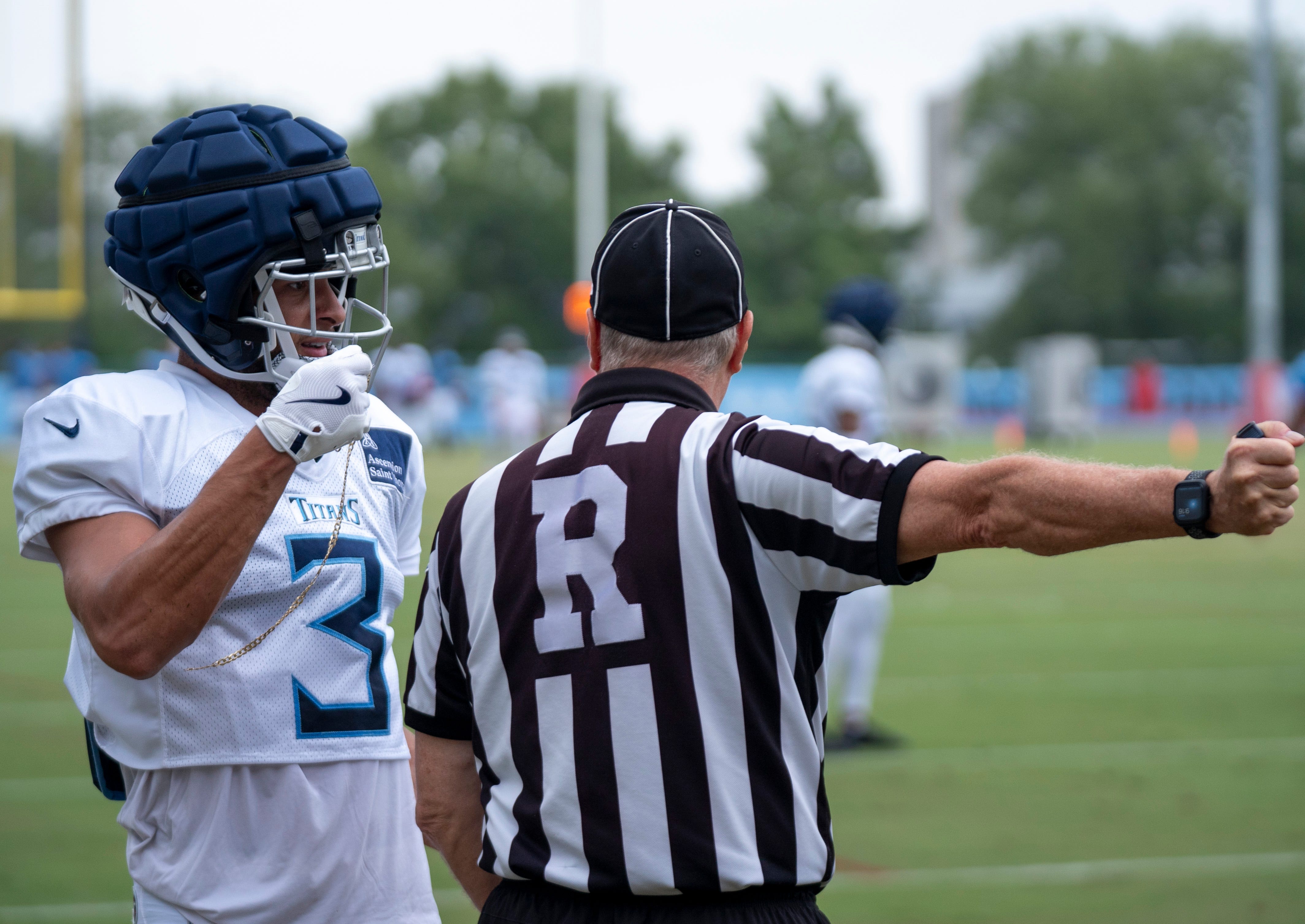 Tennessee Titans cornerback Caleb Farley (3) pleads his case after being called for a penalty in the end zone while guarding wide receiver Nick Westbrook-Ikhine (15) during training camp at Ascension Saint Thomas Sports Park Wednesday, Aug. 7, 2024. Farley told the referee Westbrook-Ikhine had pulled on his gold necklace.