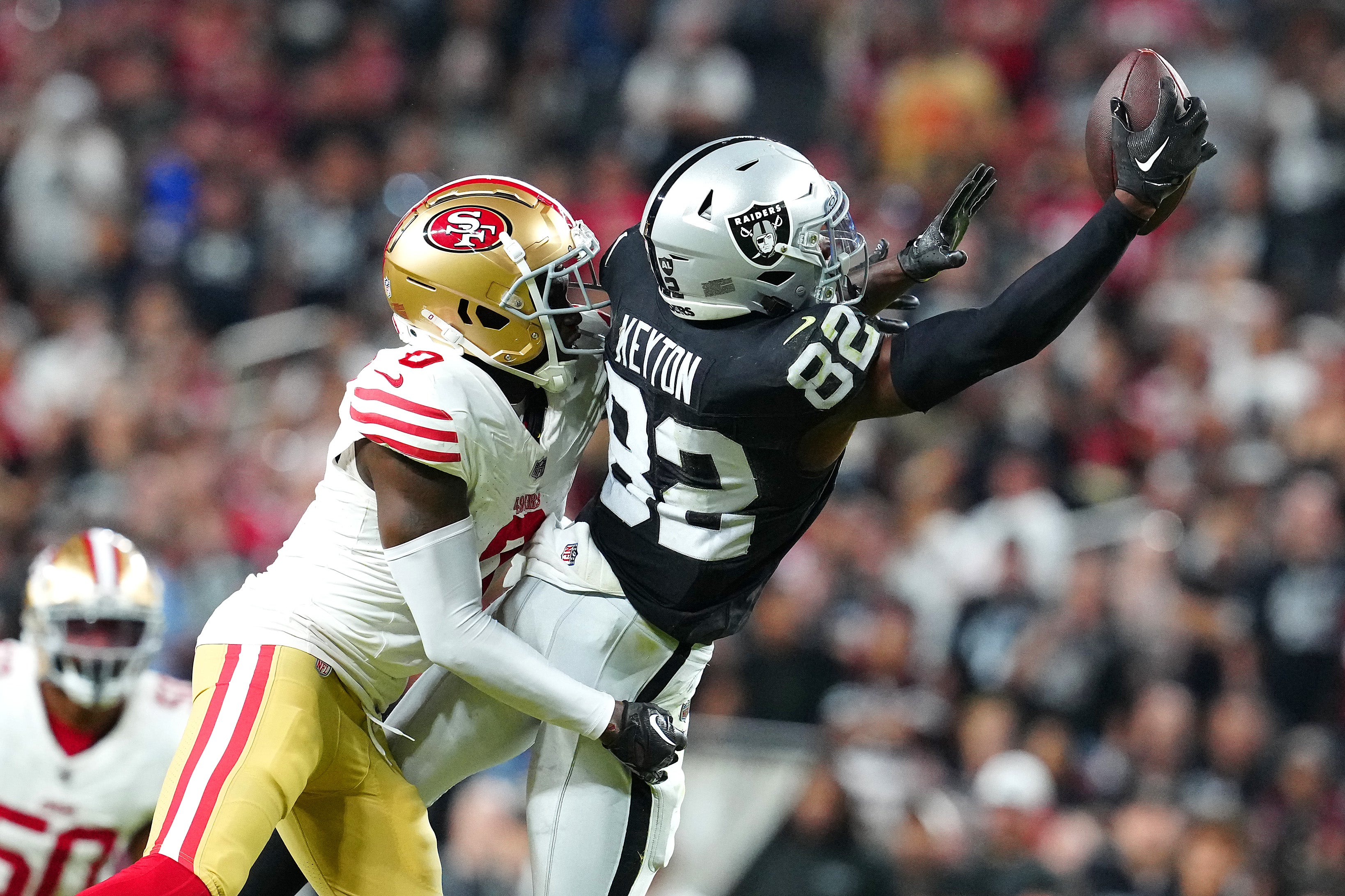 Aug 23, 2024; Paradise, Nevada, USA; Las Vegas Raiders wide receiver Ramel Keyton (82) makes a catch against San Francisco 49ers cornerback Samuel Womack III (0) during the fourth quarter at Allegiant Stadium.