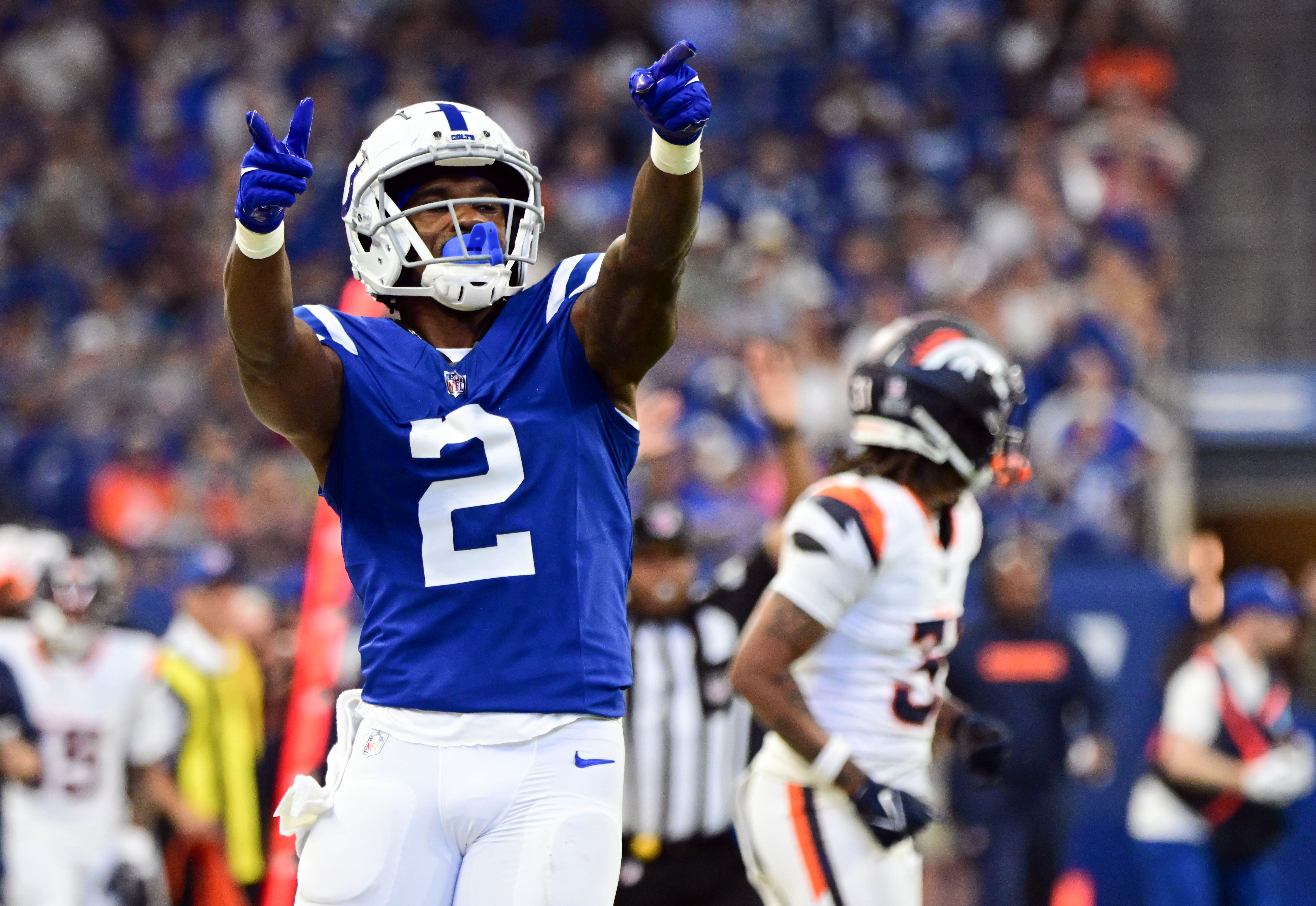 Aug 11, 2024; Indianapolis, Indiana, USA; Indianapolis Colts wide receiver D.J. Montgomery (2) points to the fans after a long run during the second quarter against the Denver Broncos at Lucas Oil Stadium.