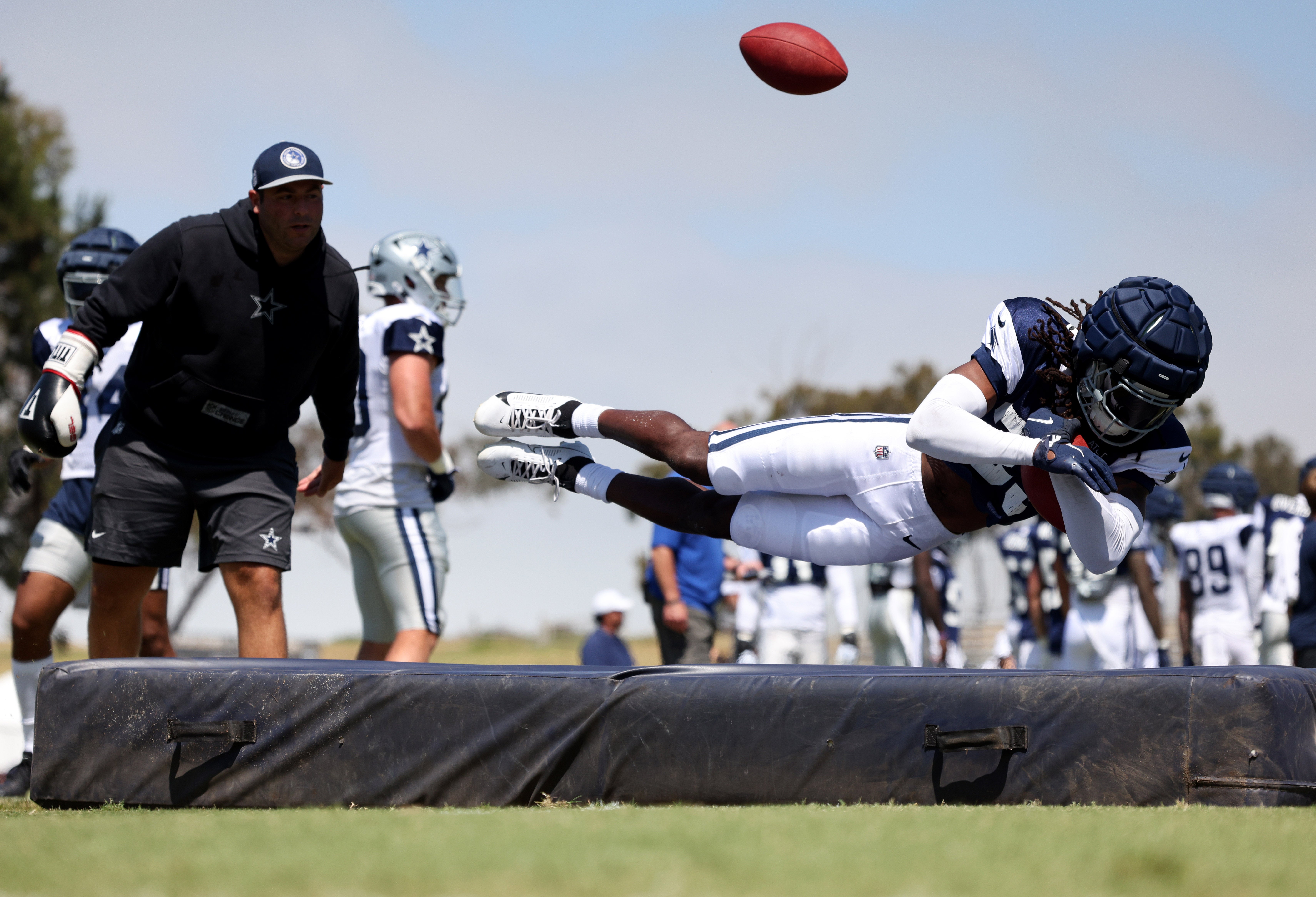 Dallas Cowboys safety Julius Wood (33) jumps on a pad during training camp at the River Ridge Playing Fields in Oxnard, California.