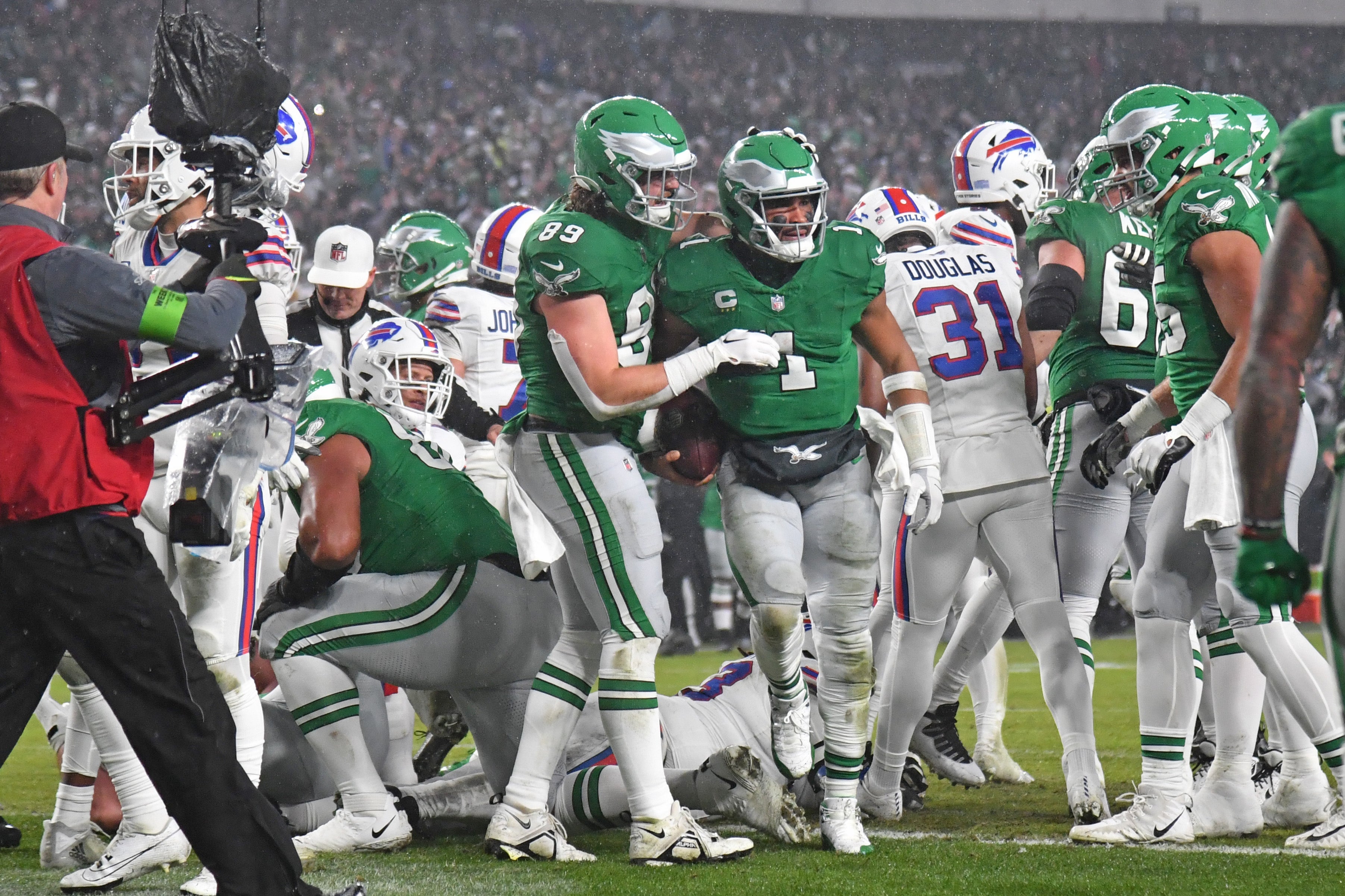 Philadelphia Eagles quarterback Jalen Hurts (1) celebrates his touchdown run with tight end Jack Stoll (89) against the Buffalo Bills during the first quarter at Lincoln Financial Field.